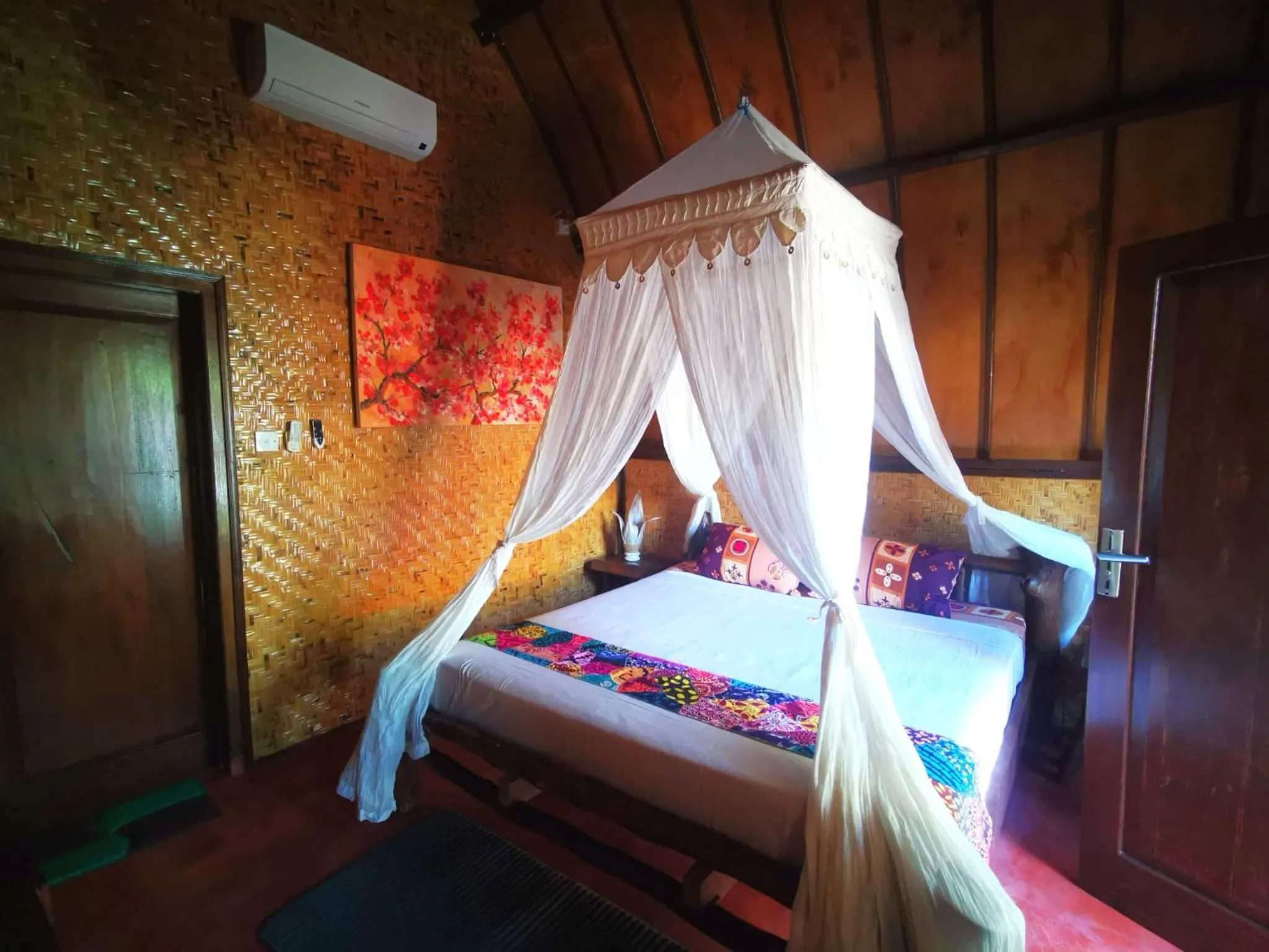 Bed in Kampung Meno Bungalows