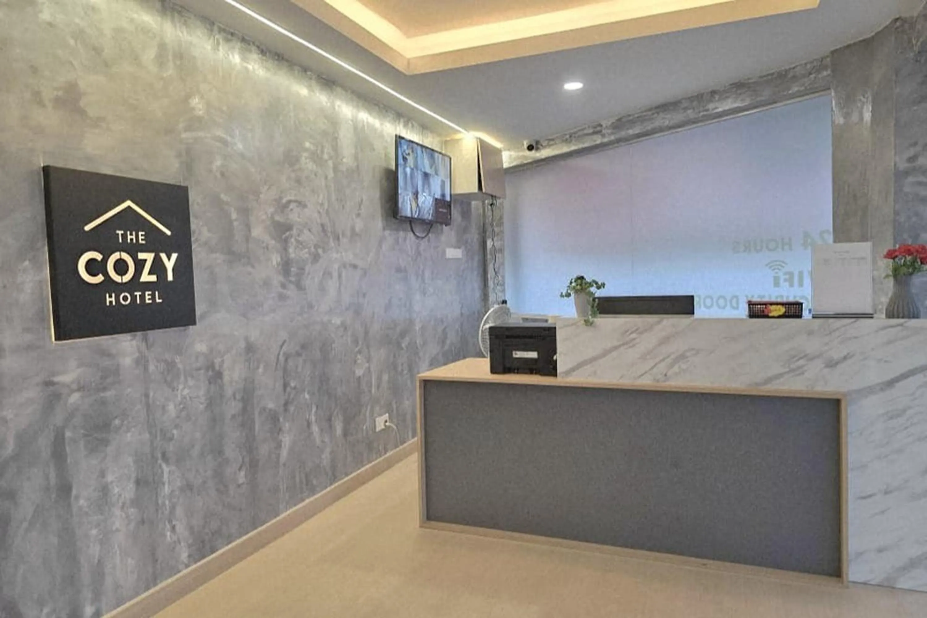 Lobby or reception in The Cozy Hotel