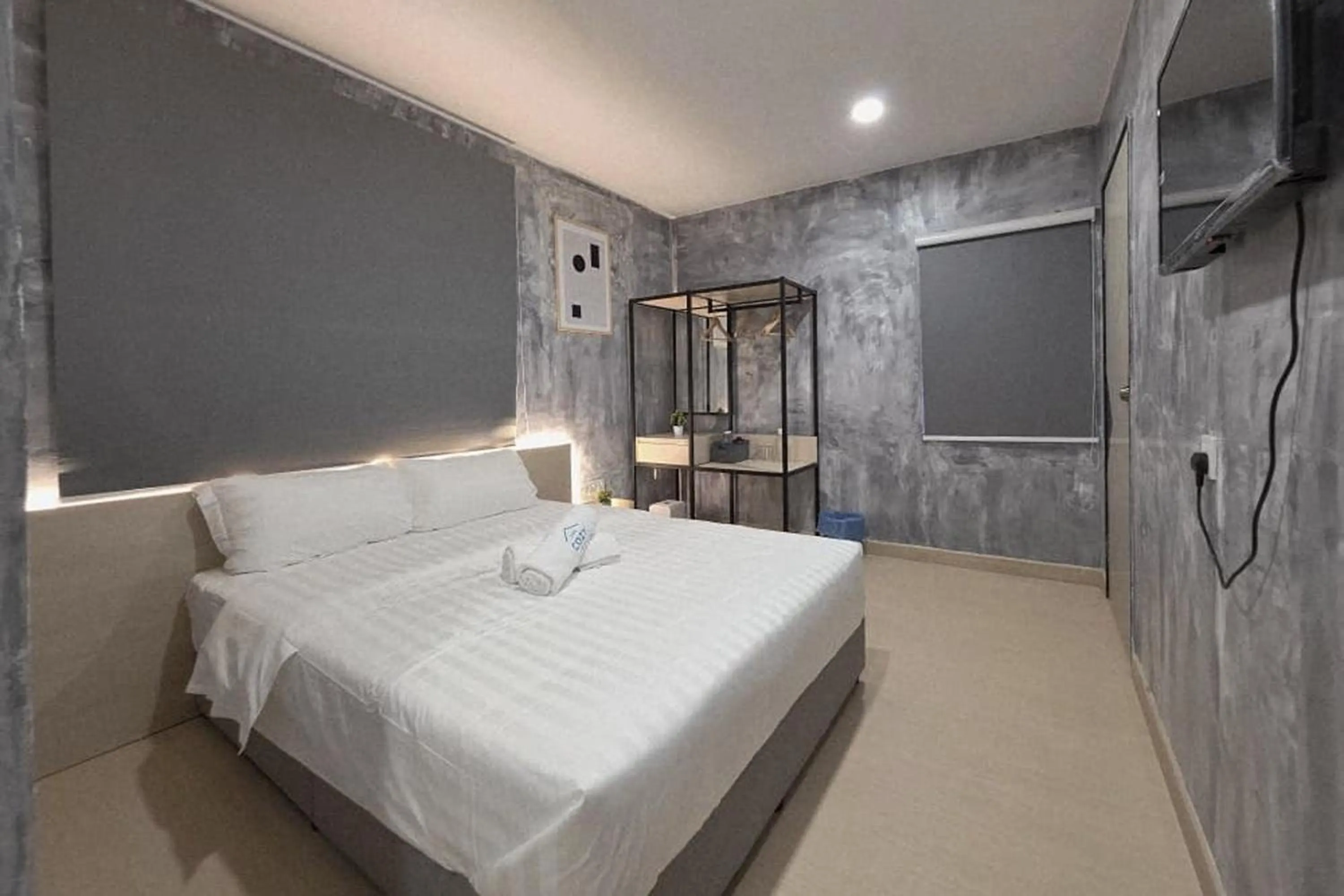 Bed in The Cozy Hotel