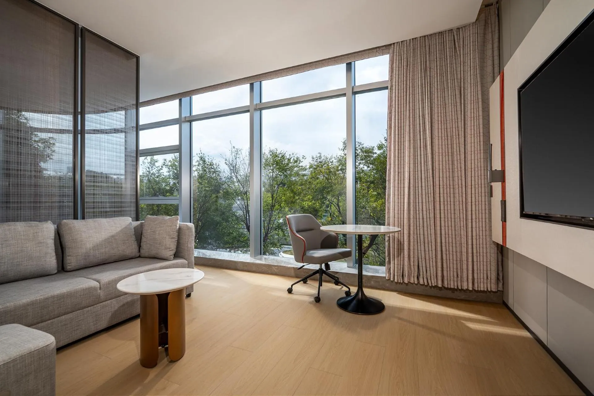 Living room in Holiday Inn Express Shenzhen Sports Center by IHG