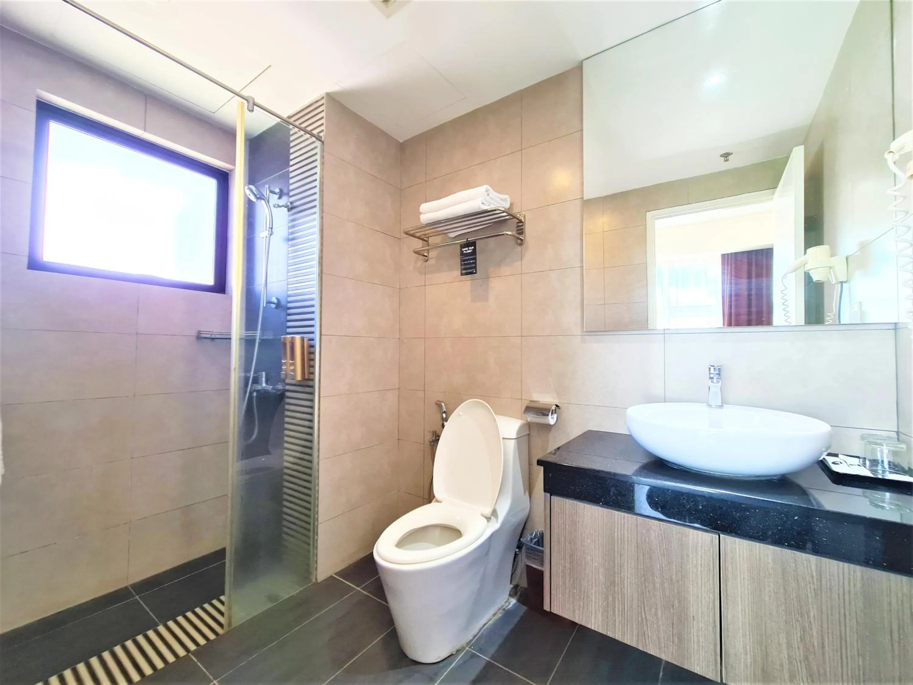 Toilet in Nexus Business Suite Hotel