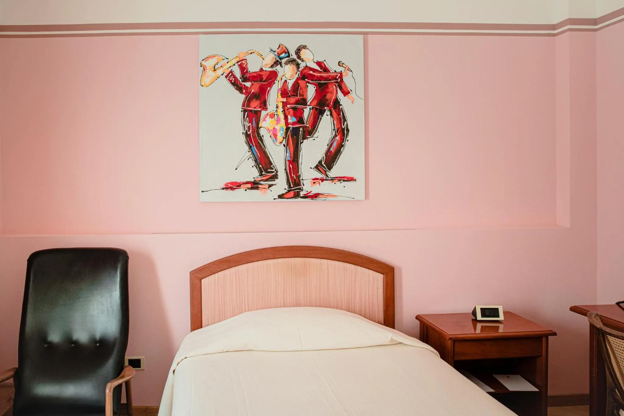 Bed in Hotel San Genesio