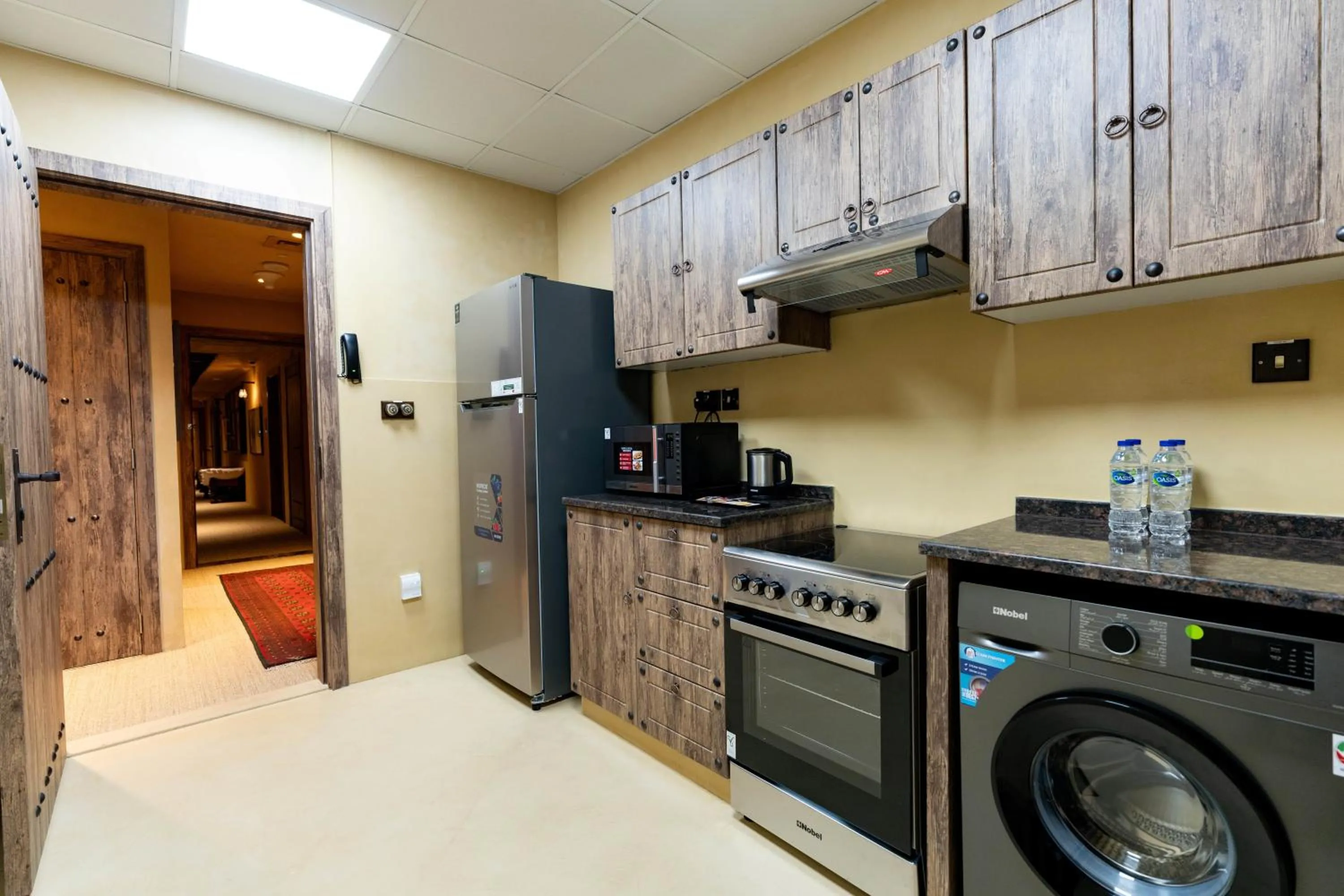 Kitchen or kitchenette in The Luxe Retreat Hotel Apartments
