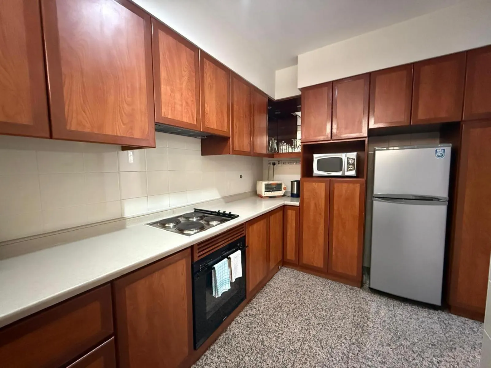Kitchen or kitchenette in Alocassia Serviced Apartments