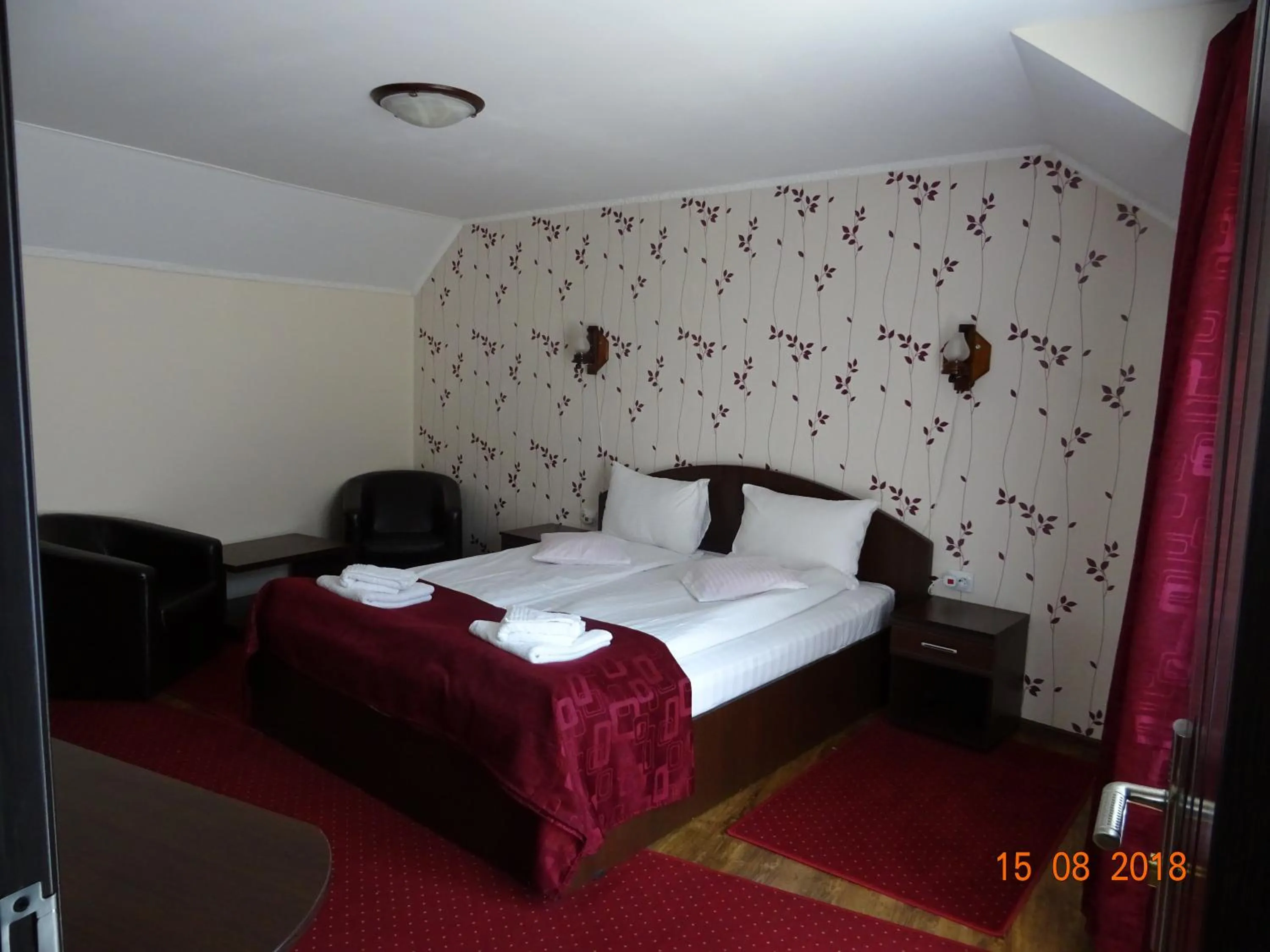 Photo of the whole room, Bed in Pensiunea Magnolia