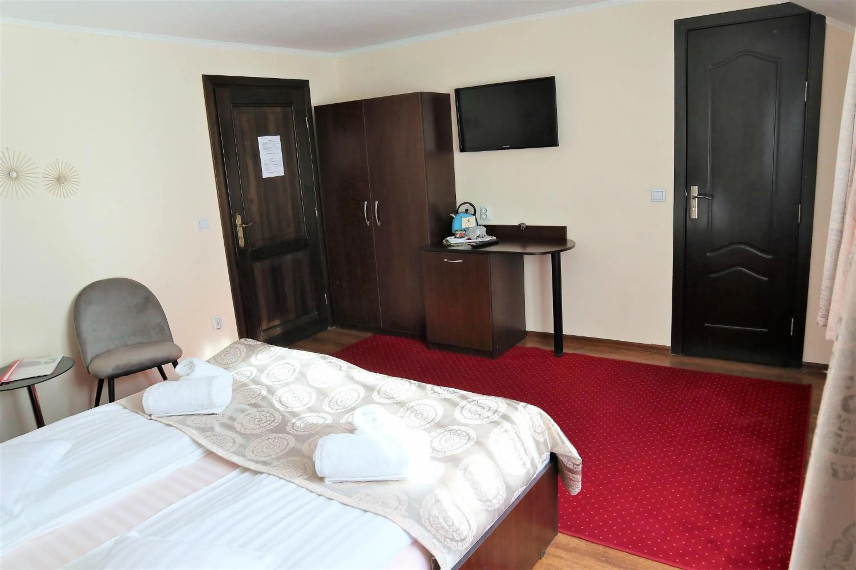 Photo of the whole room, Bed in Pensiunea Magnolia