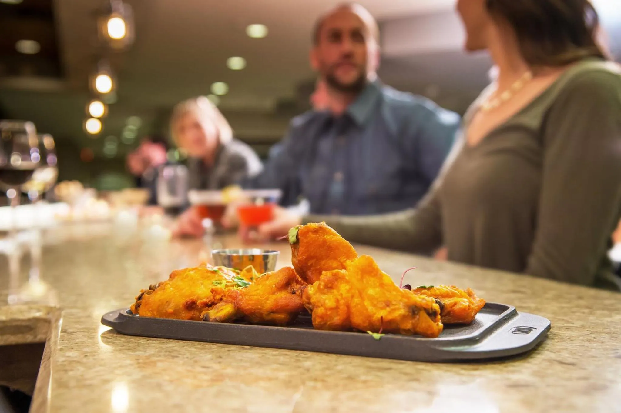 Lounge or bar in Hotel Indigo Traverse City by IHG