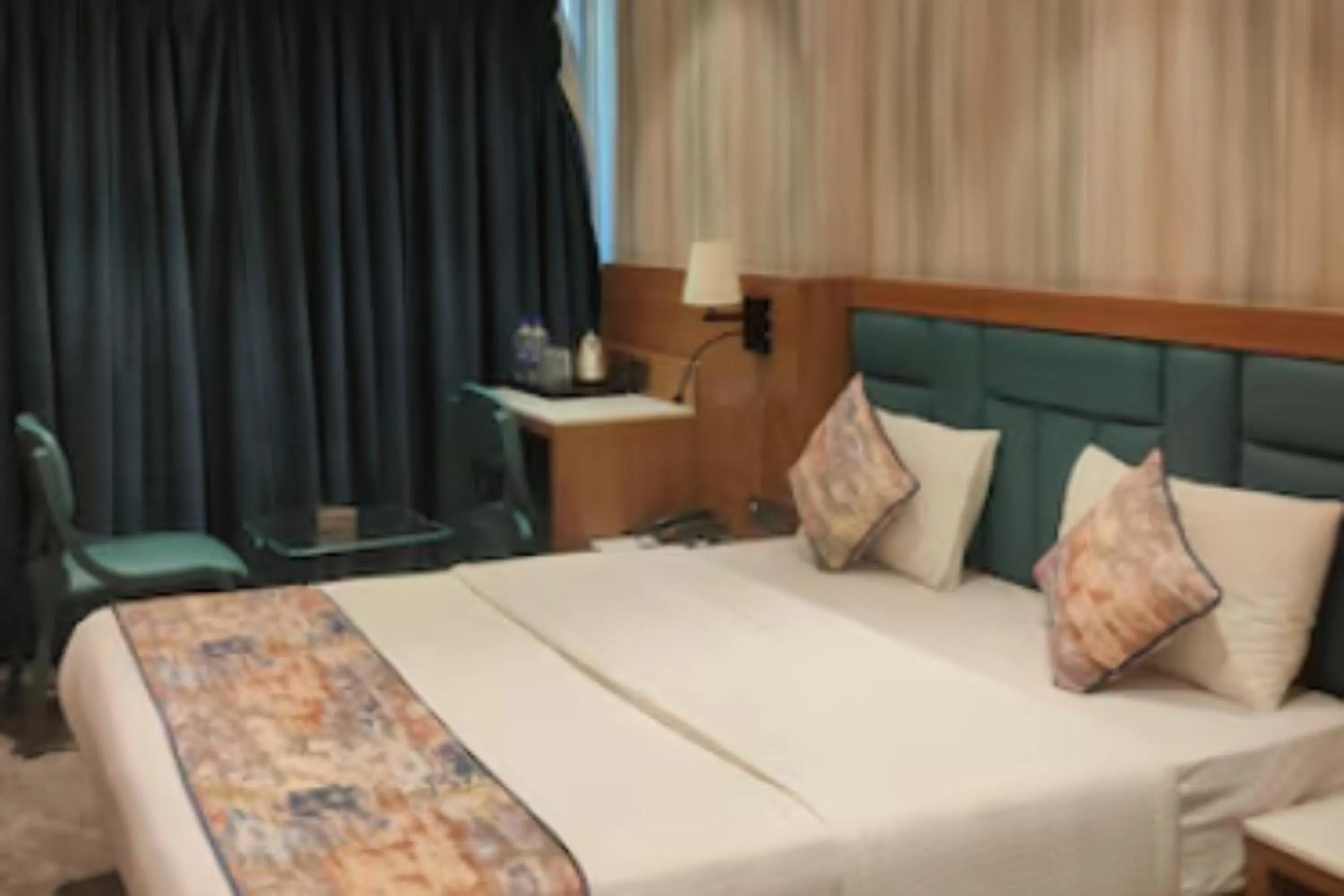 Bed in Dream Residency Hotels Pvt Ltd