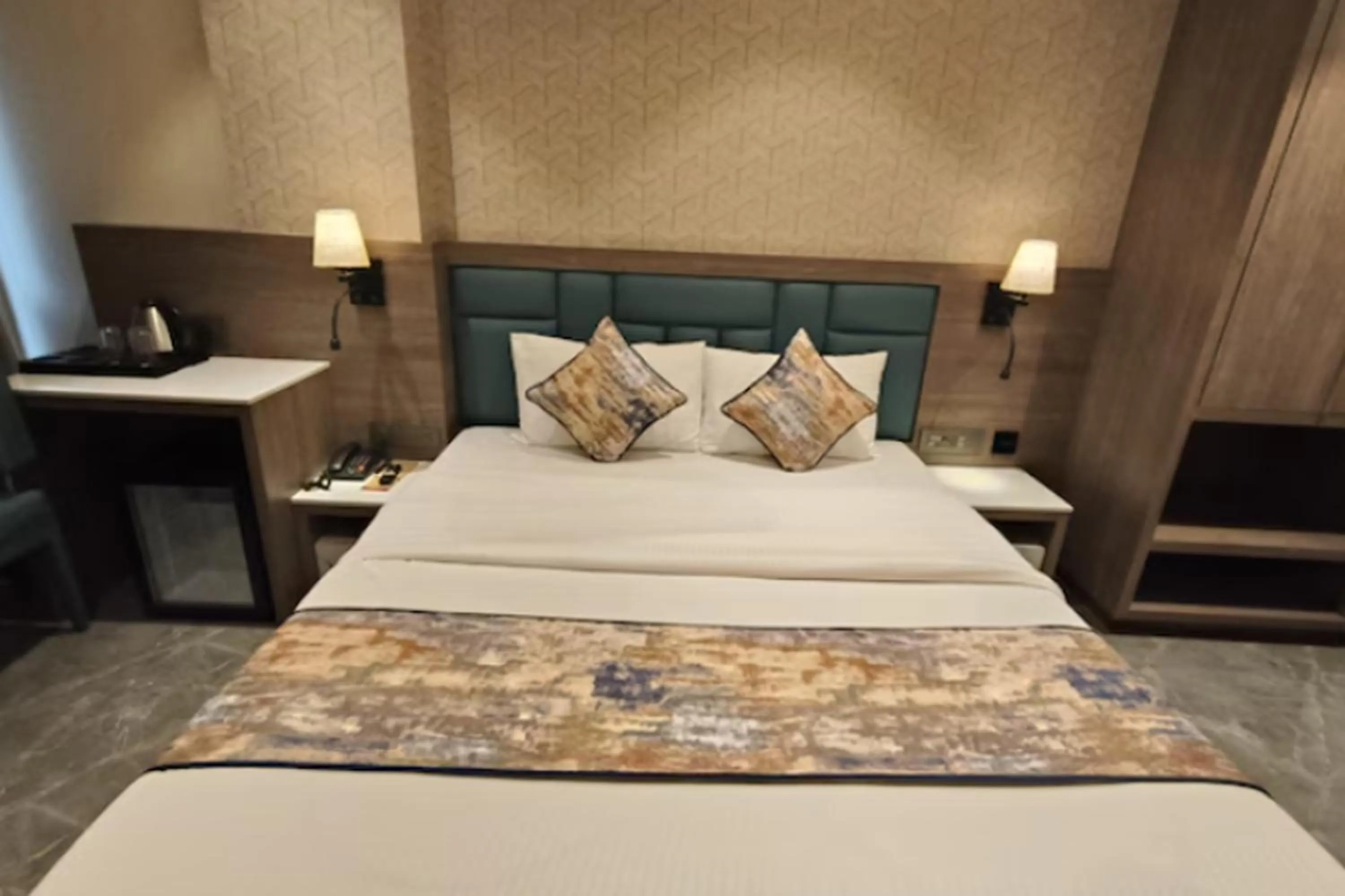 Bed in Dream Residency Hotels Pvt Ltd