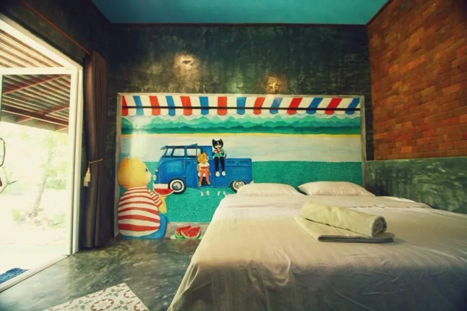 Bed in Sawasdeepai River Resort