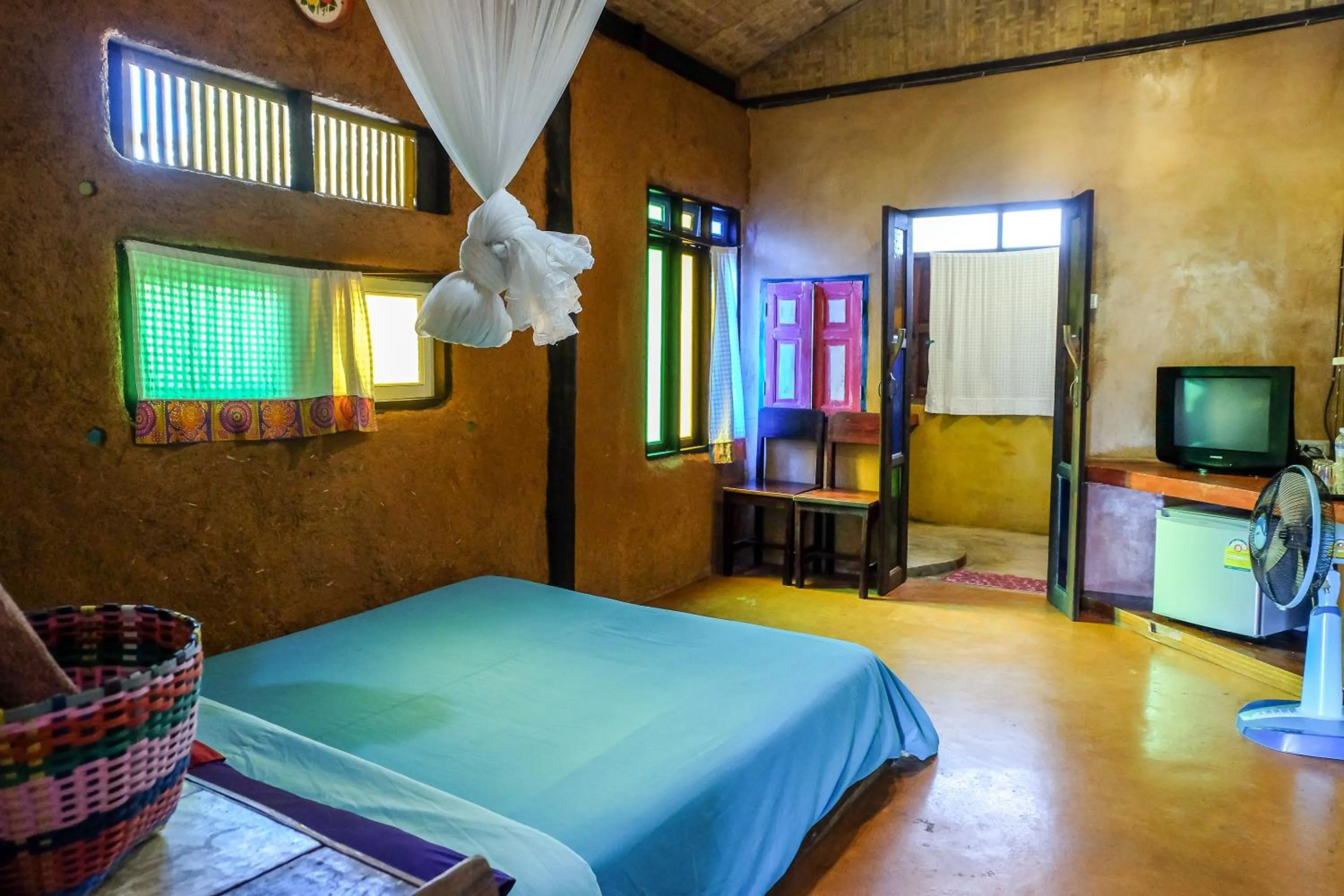 Bed in Sawasdeepai River Resort