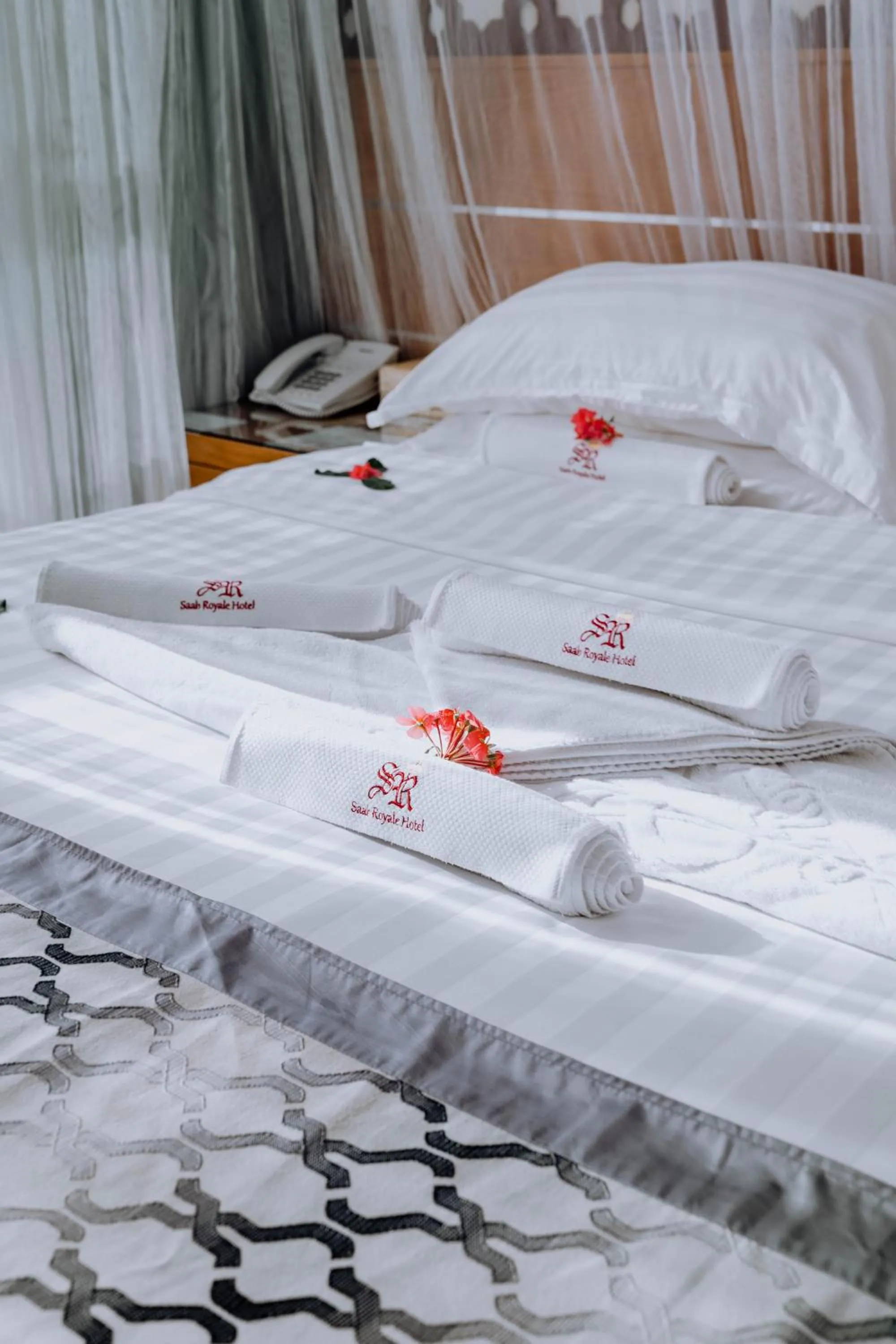 Bed in Saab Royale Hotel