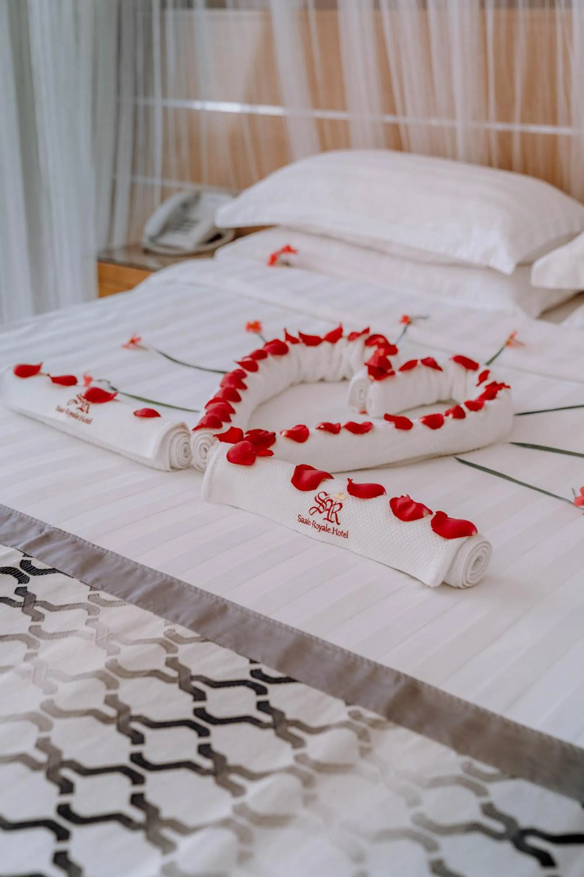 Bed in Saab Royale Hotel