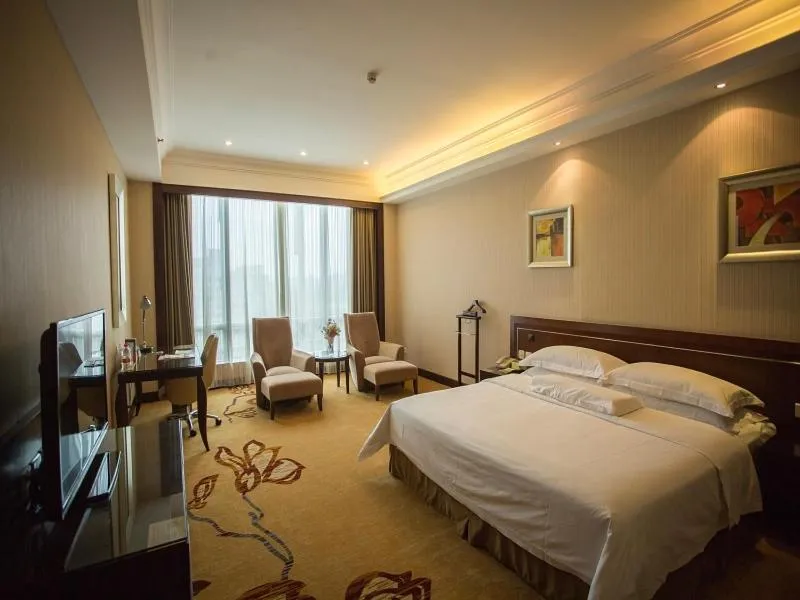 Bed in Vienna International Hotel Shenzhen Hua'nan City