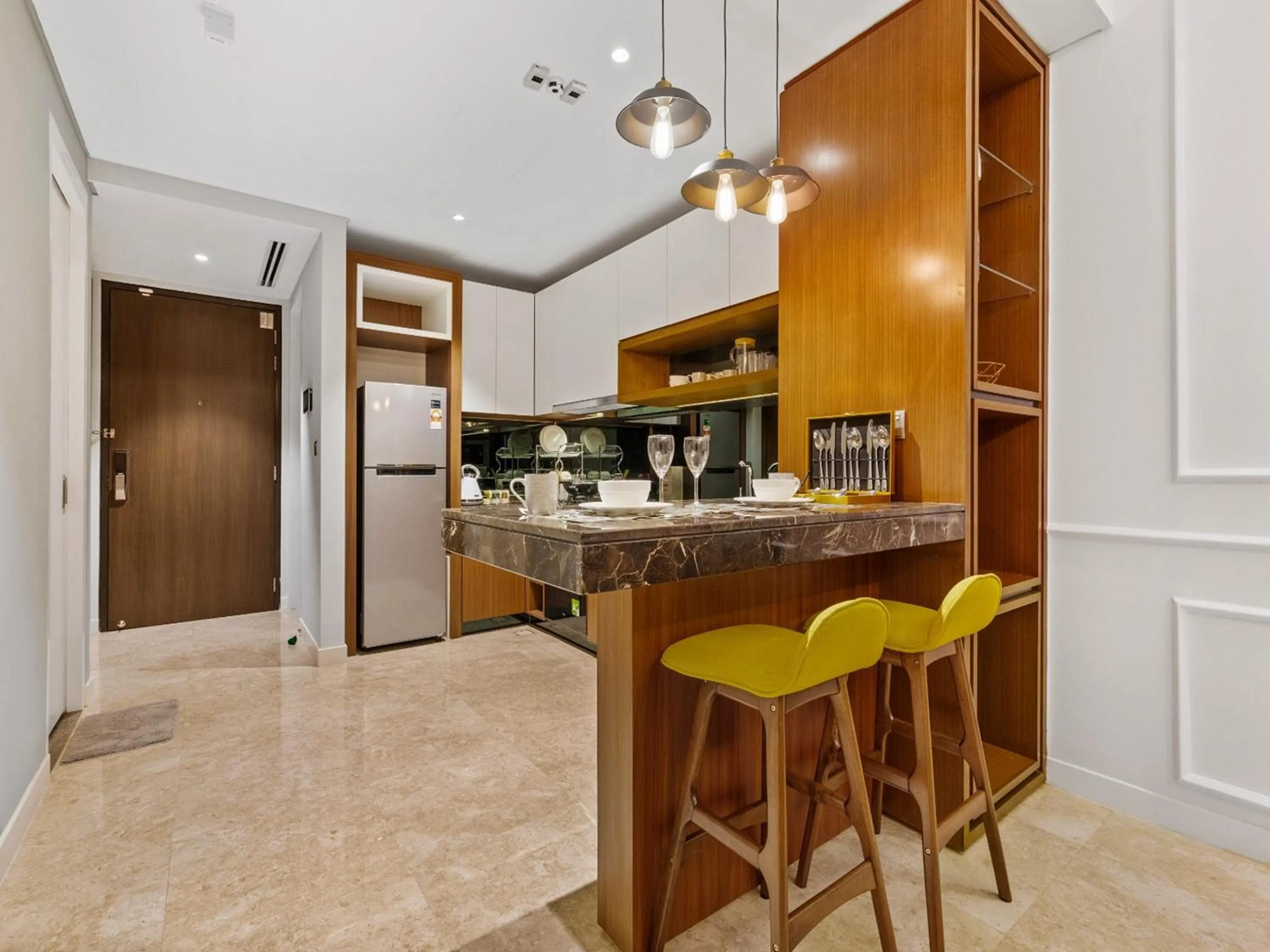 Kitchen or kitchenette in Leo Guesthouse at Anggun Residence Suite