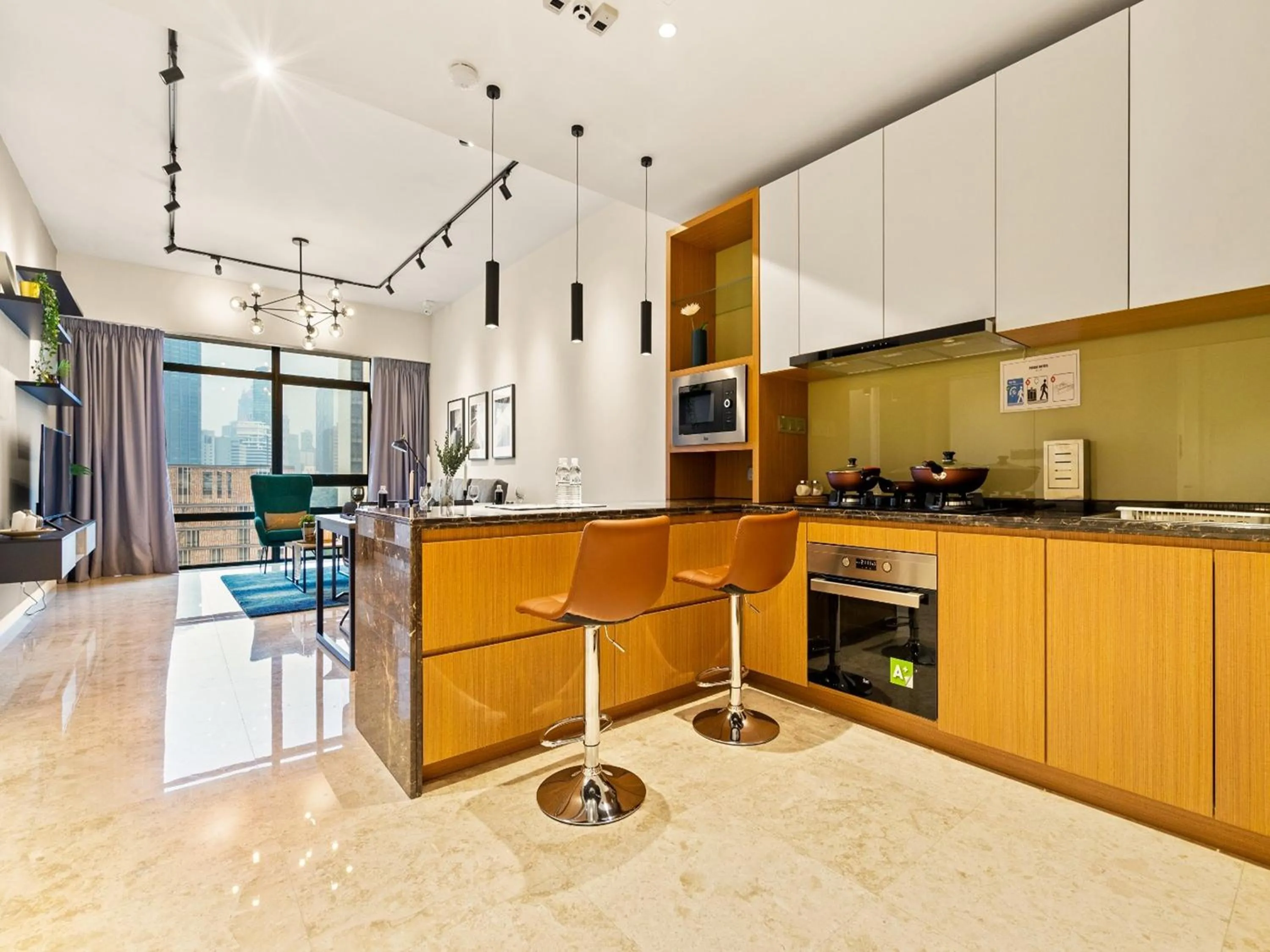 Kitchen or kitchenette in Leo Guesthouse at Anggun Residence Suite