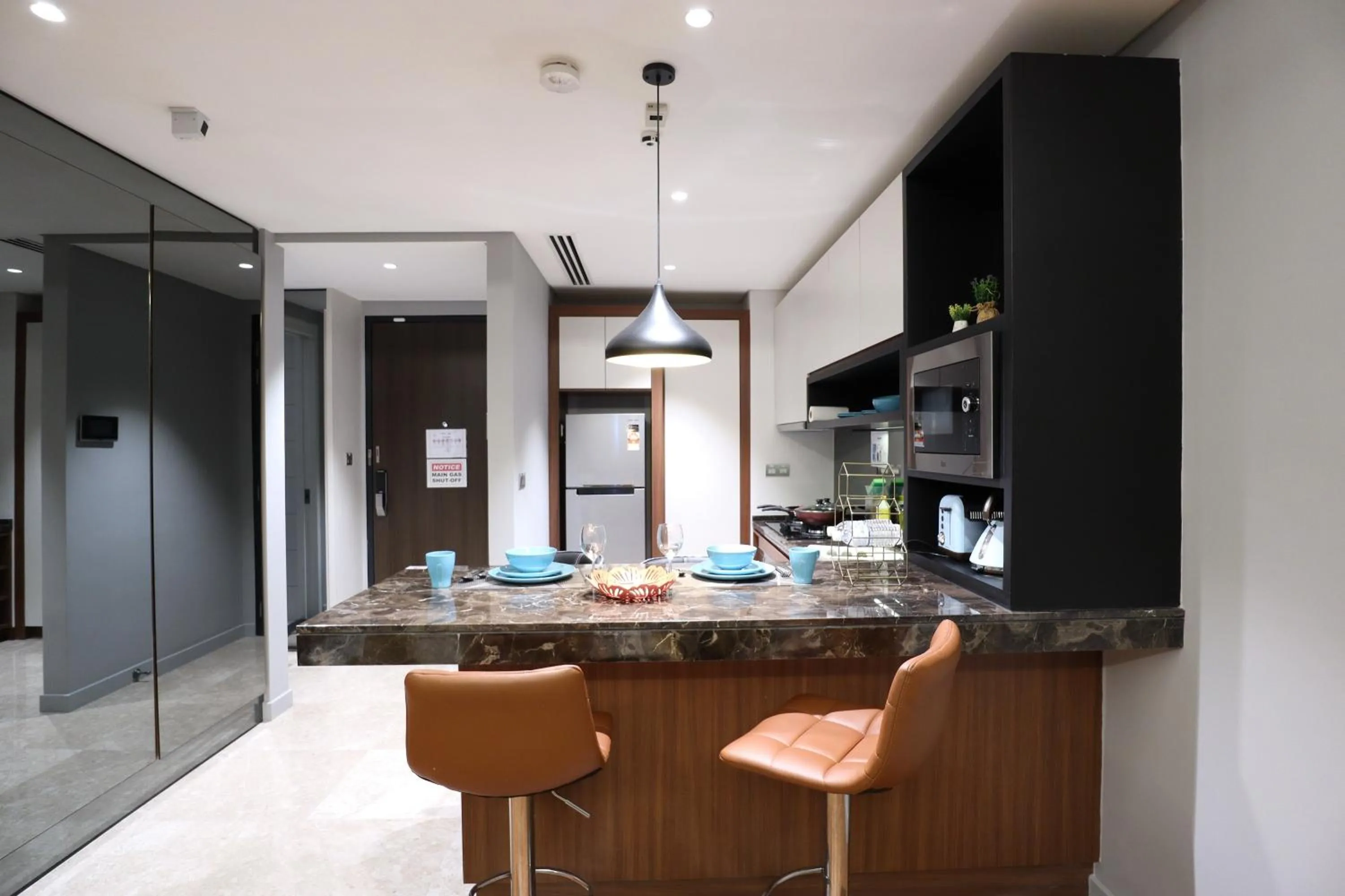 Kitchen or kitchenette in Leo Guesthouse at Anggun Residence Suite