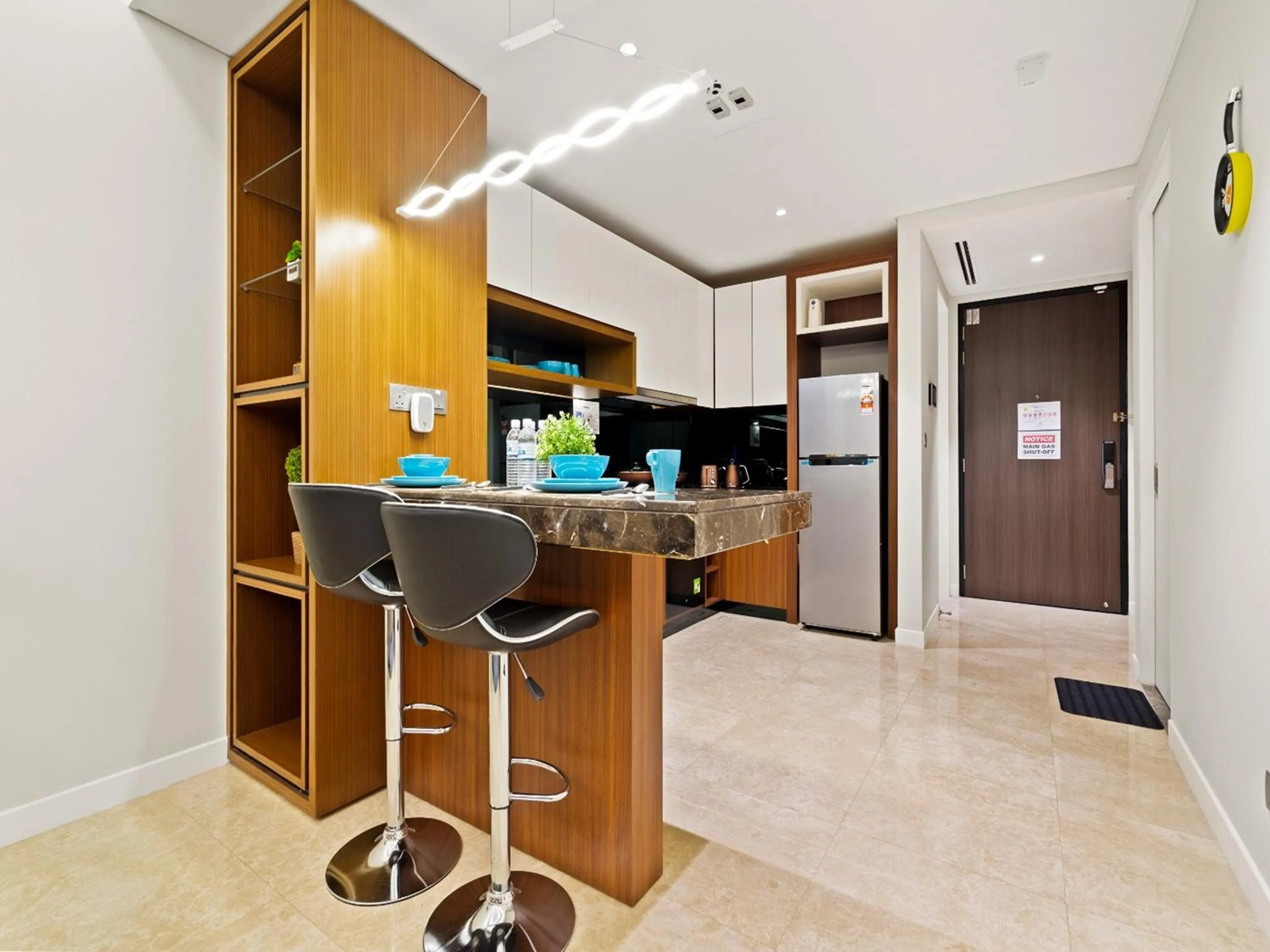 Kitchen or kitchenette in Leo Guesthouse at Anggun Residence Suite