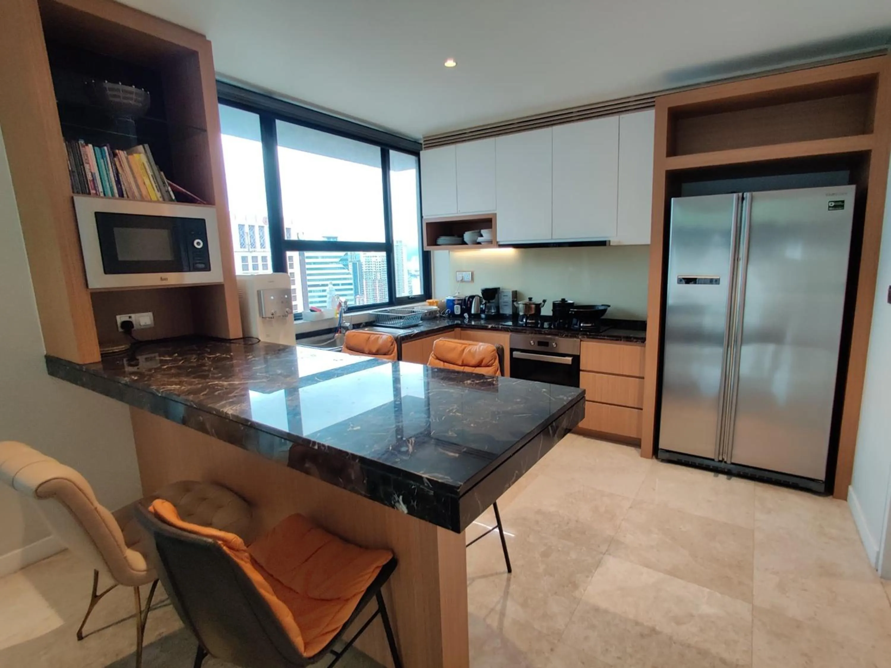 Kitchen or kitchenette in Leo Guesthouse at Anggun Residence Suite