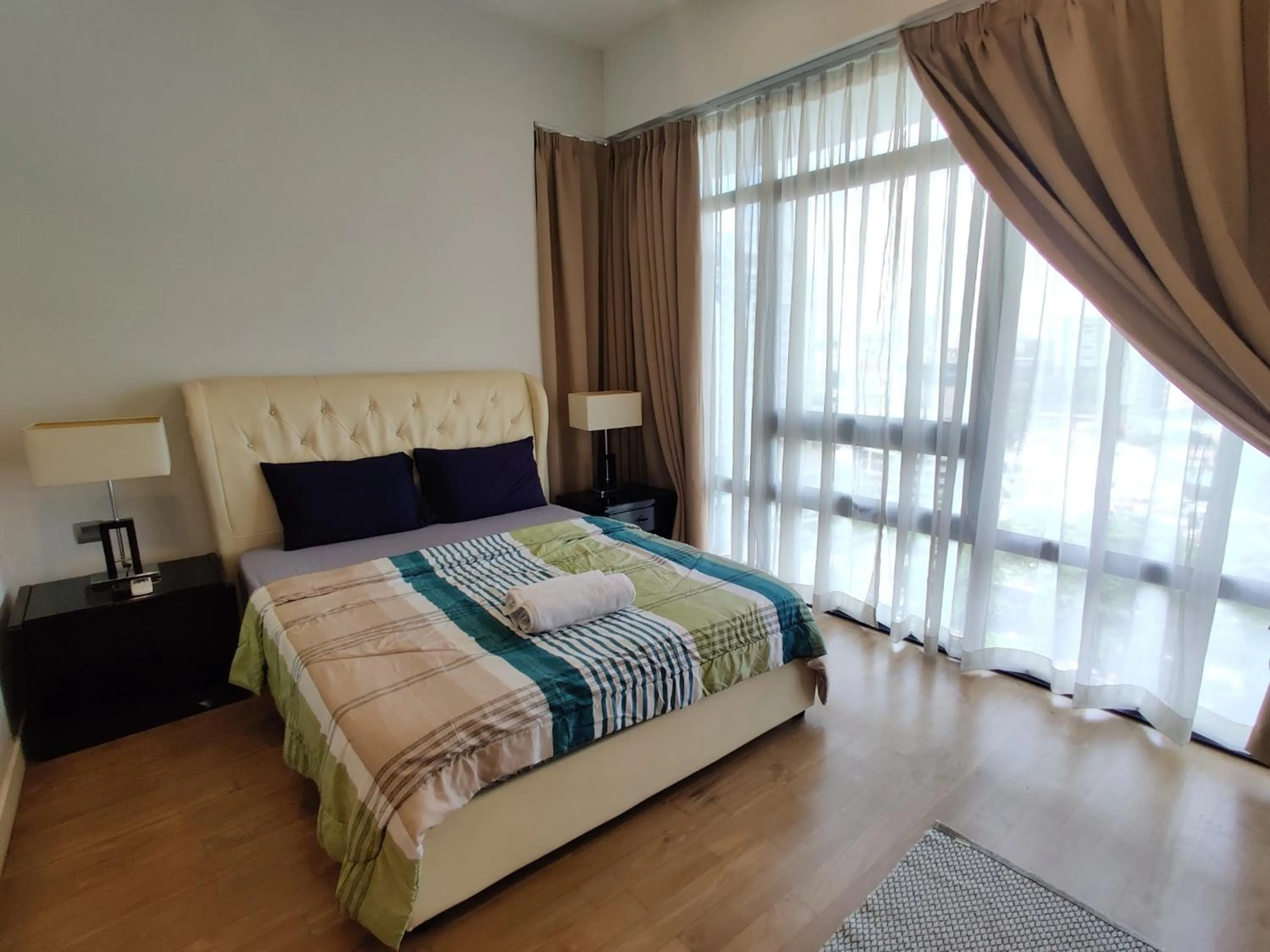 Bed in Leo Guesthouse at Anggun Residence Suite