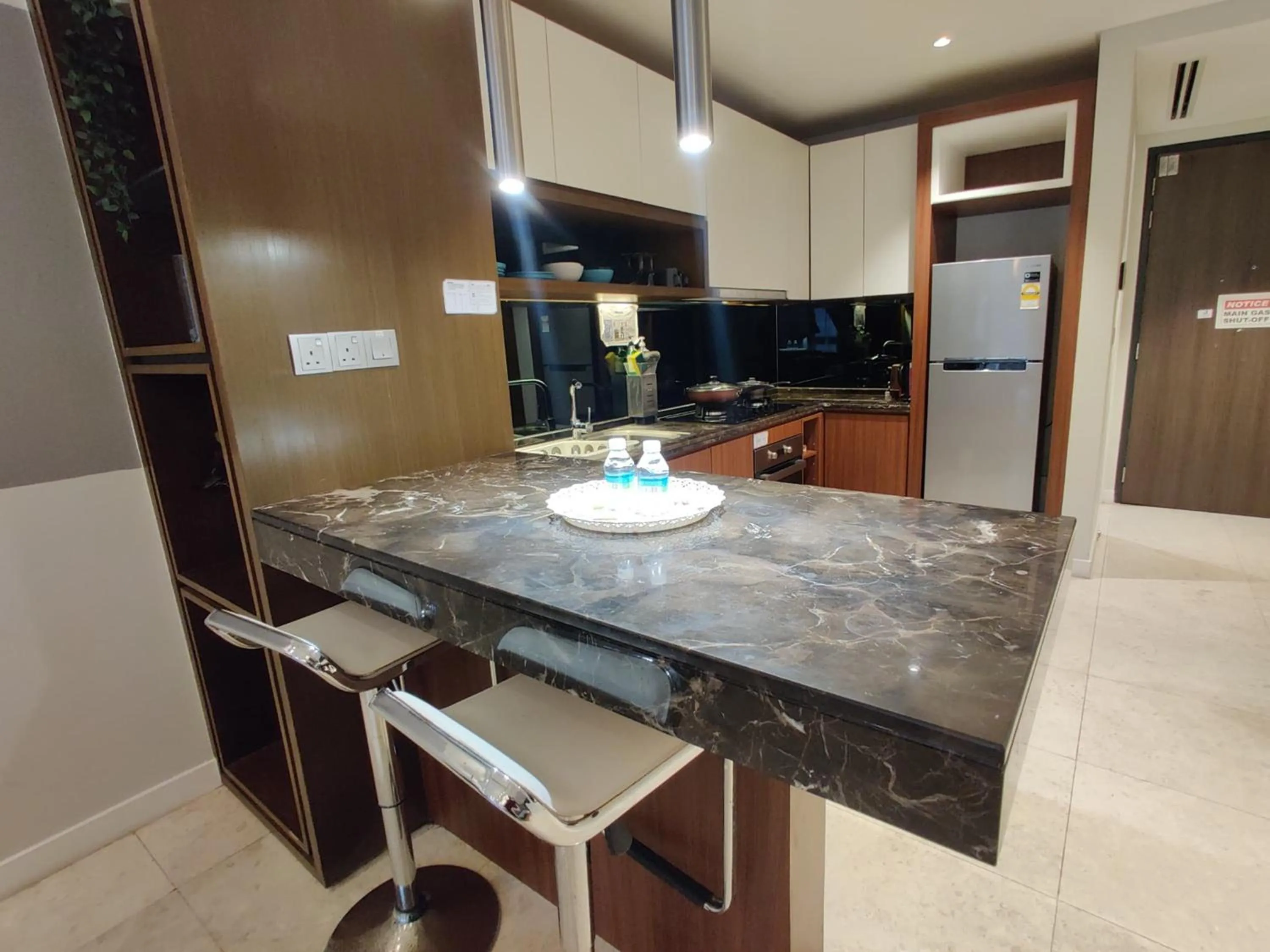 Kitchen or kitchenette in Leo Guesthouse at Anggun Residence Suite