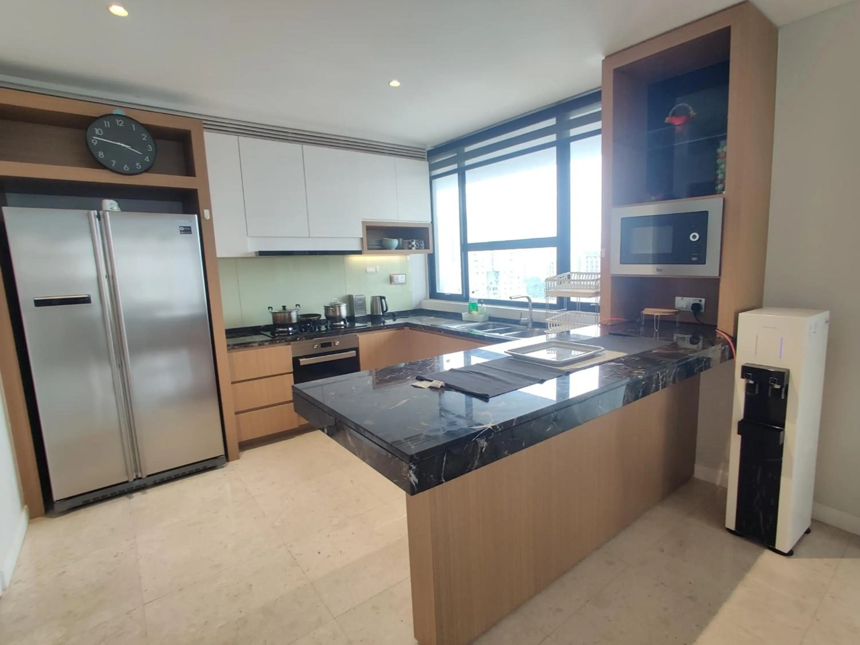 Kitchen or kitchenette in Leo Guesthouse at Anggun Residence Suite