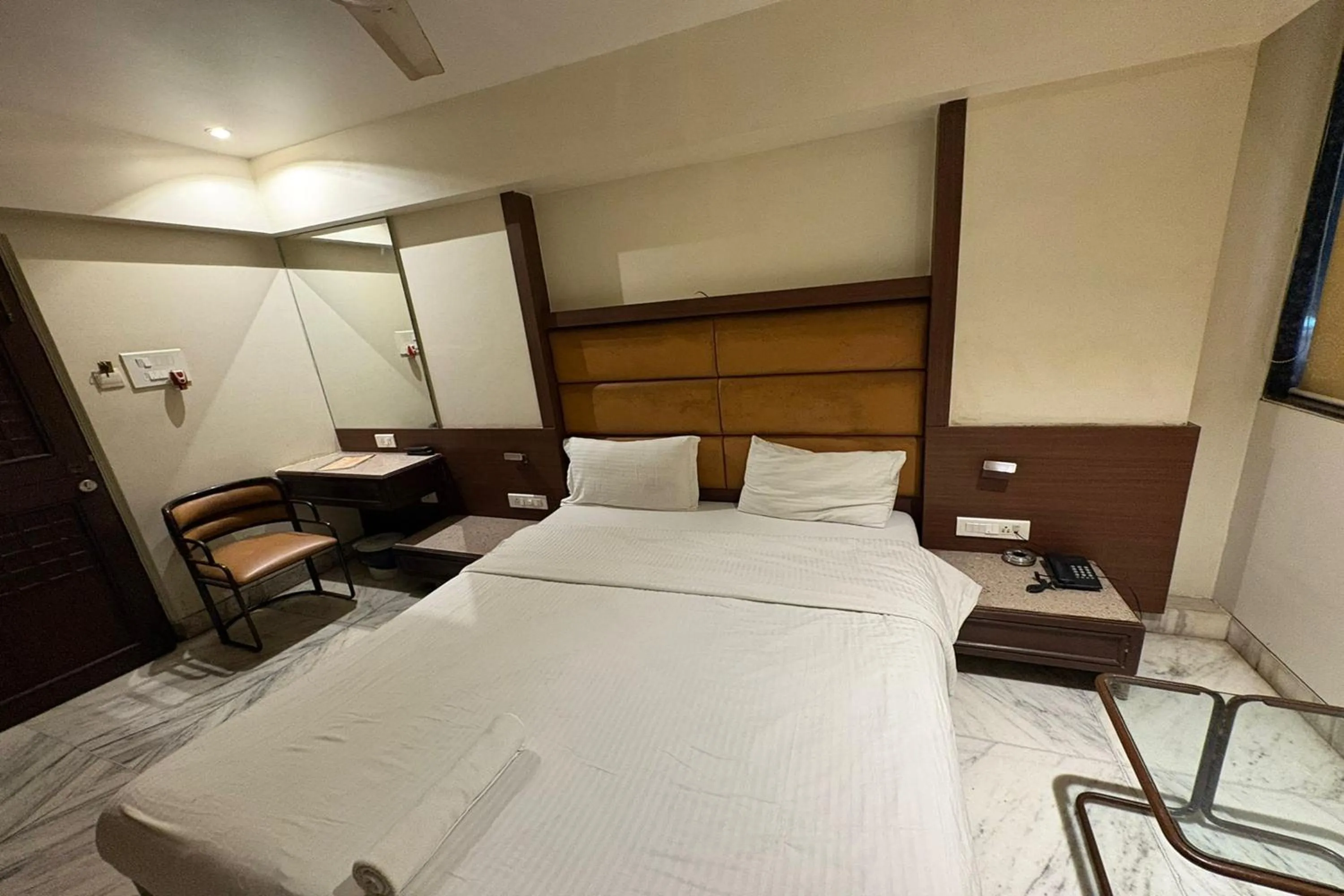 Bed in Pravasi Residency