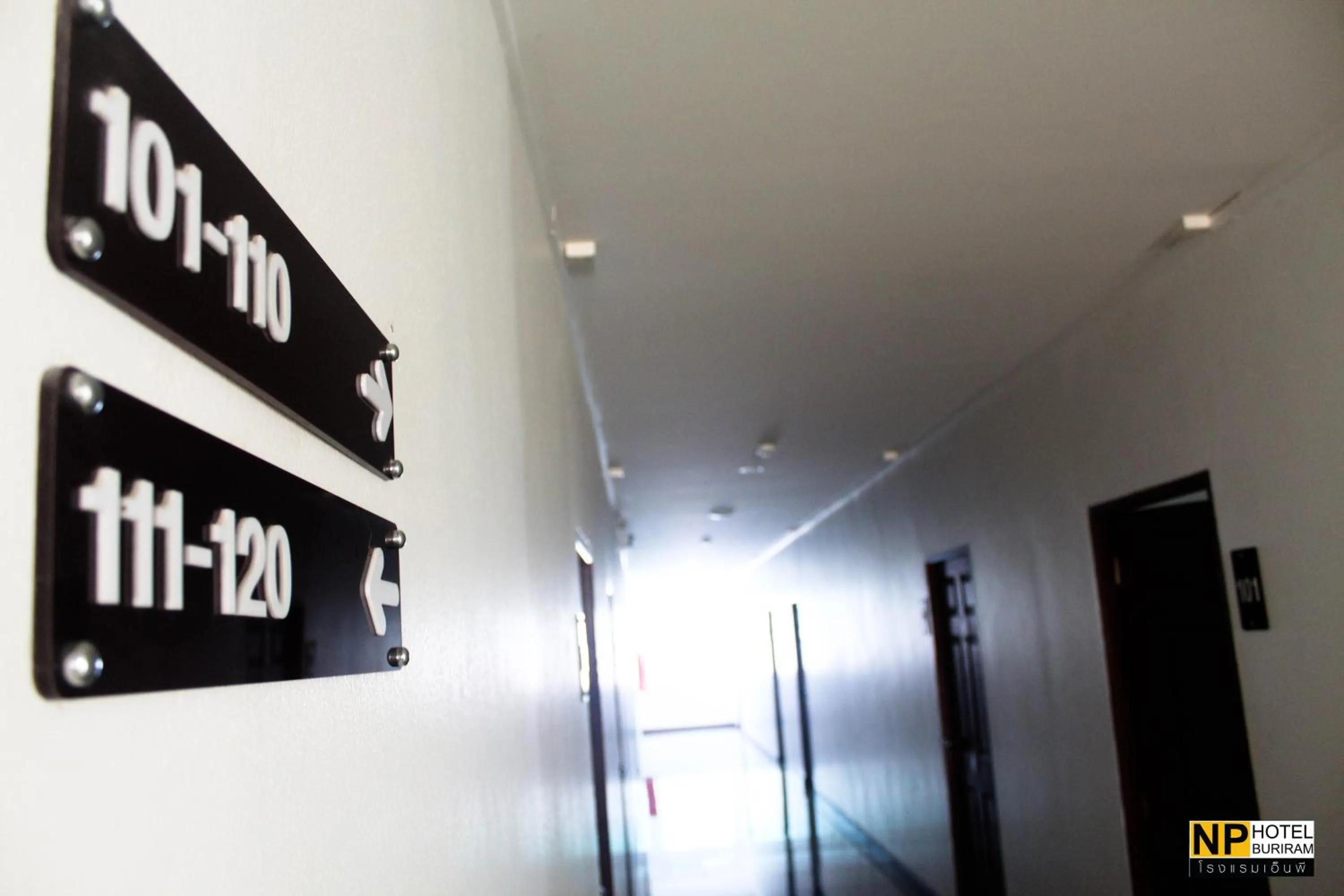 Property logo or sign in NP Hotel