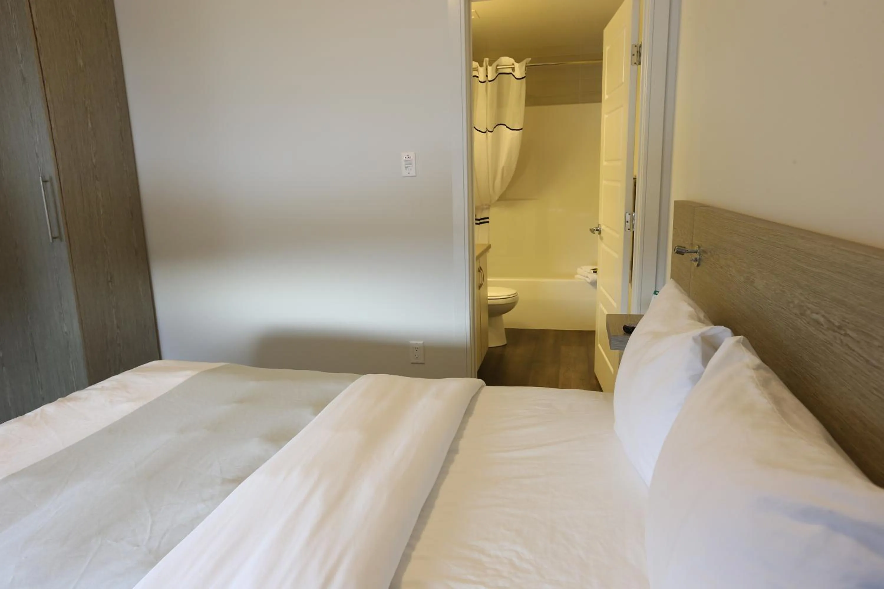 Bed in Ramada by Wyndham Fort McMurray