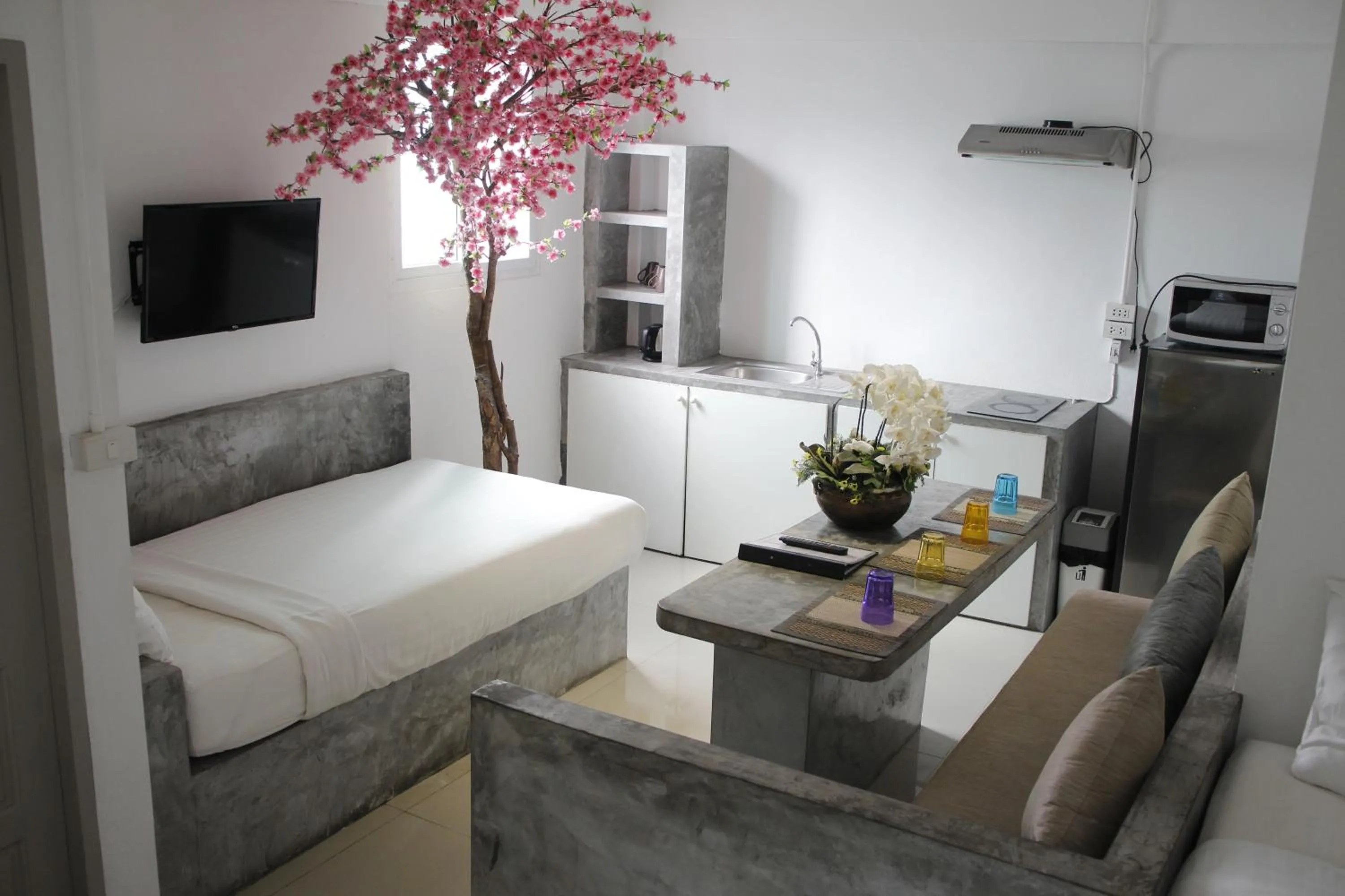 Living room, Bed in Samui Beach Residence Hotel