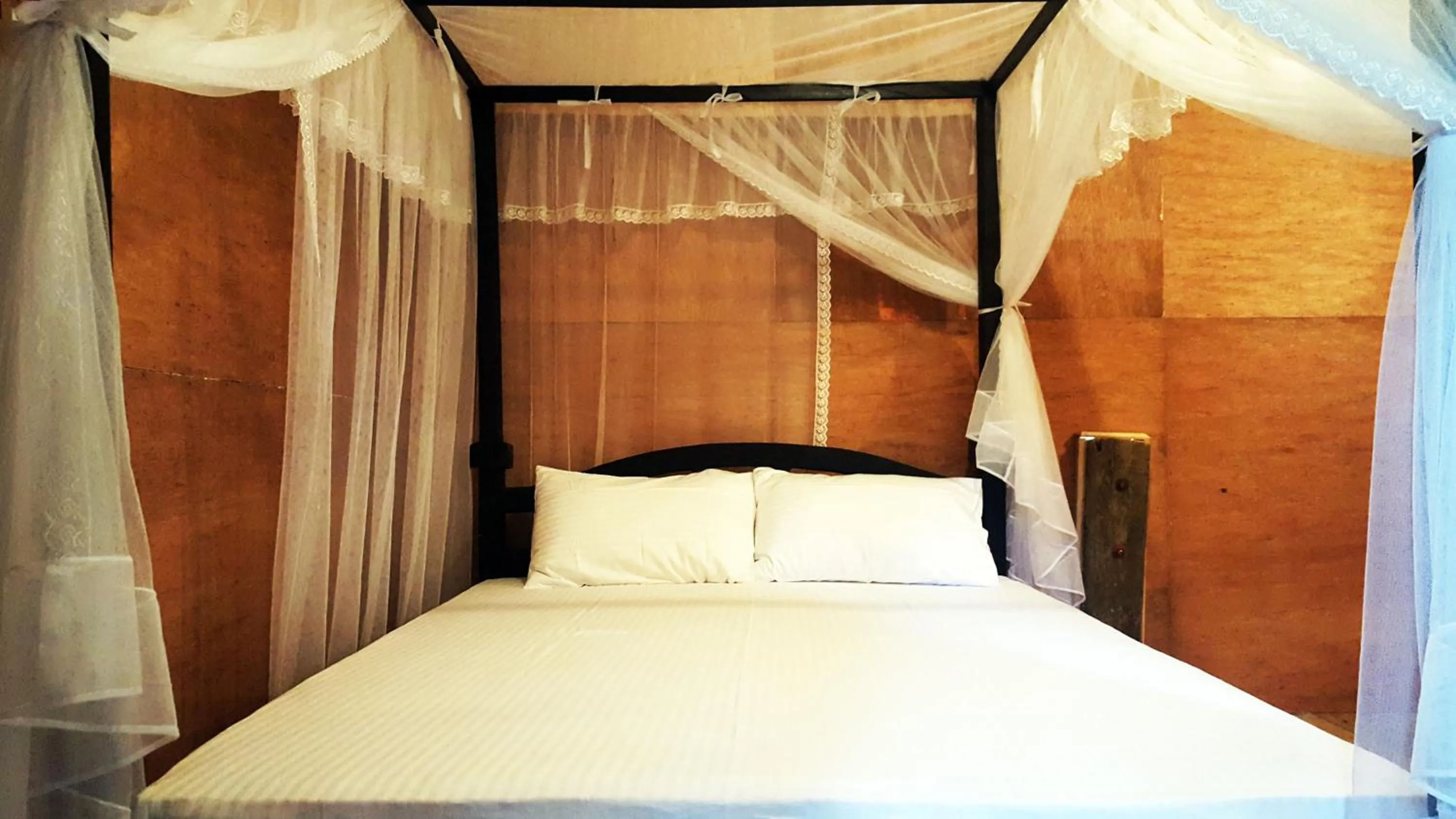 Bed in Sigiriya River Side Villa