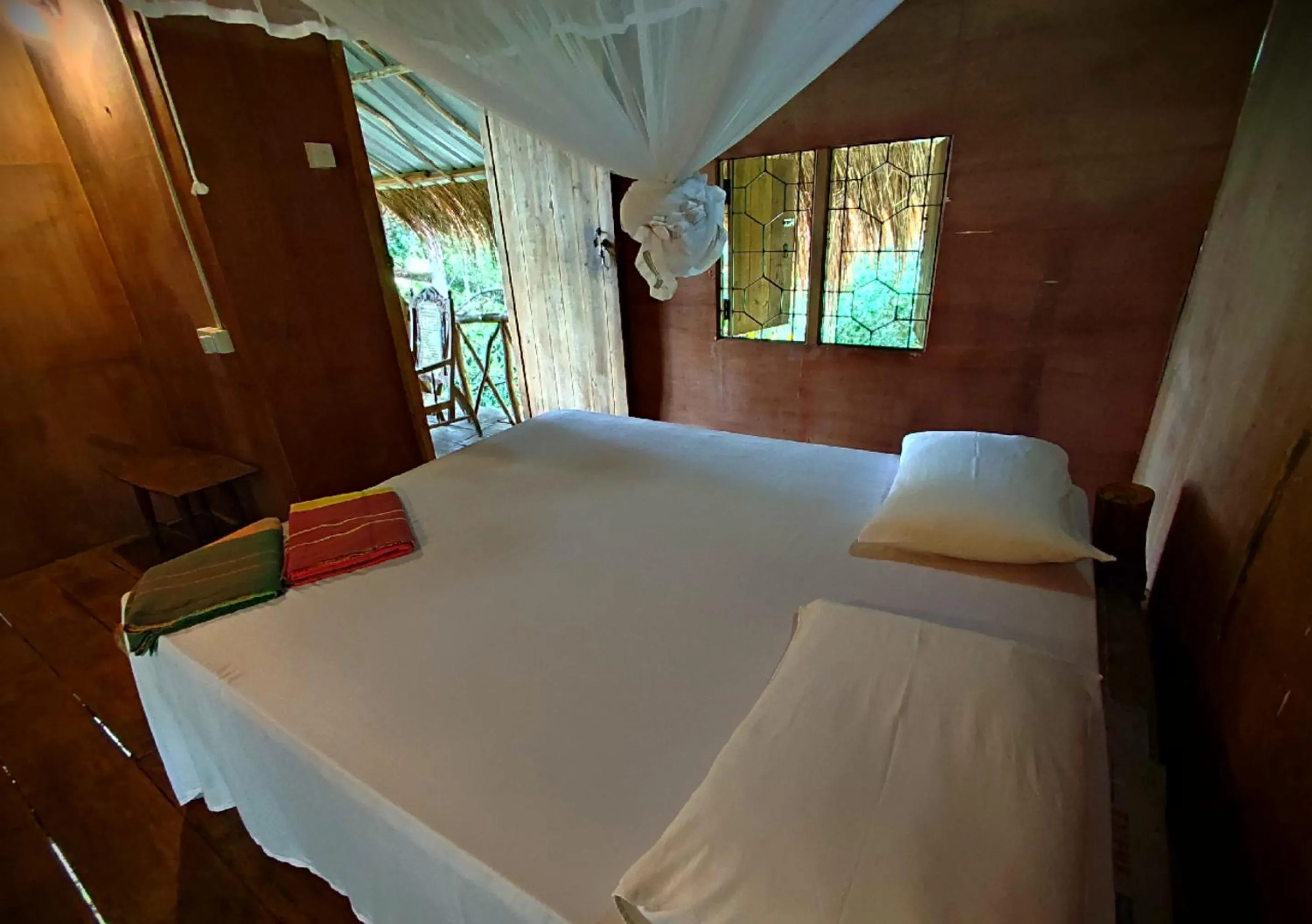Bed in Sigiriya River Side Villa