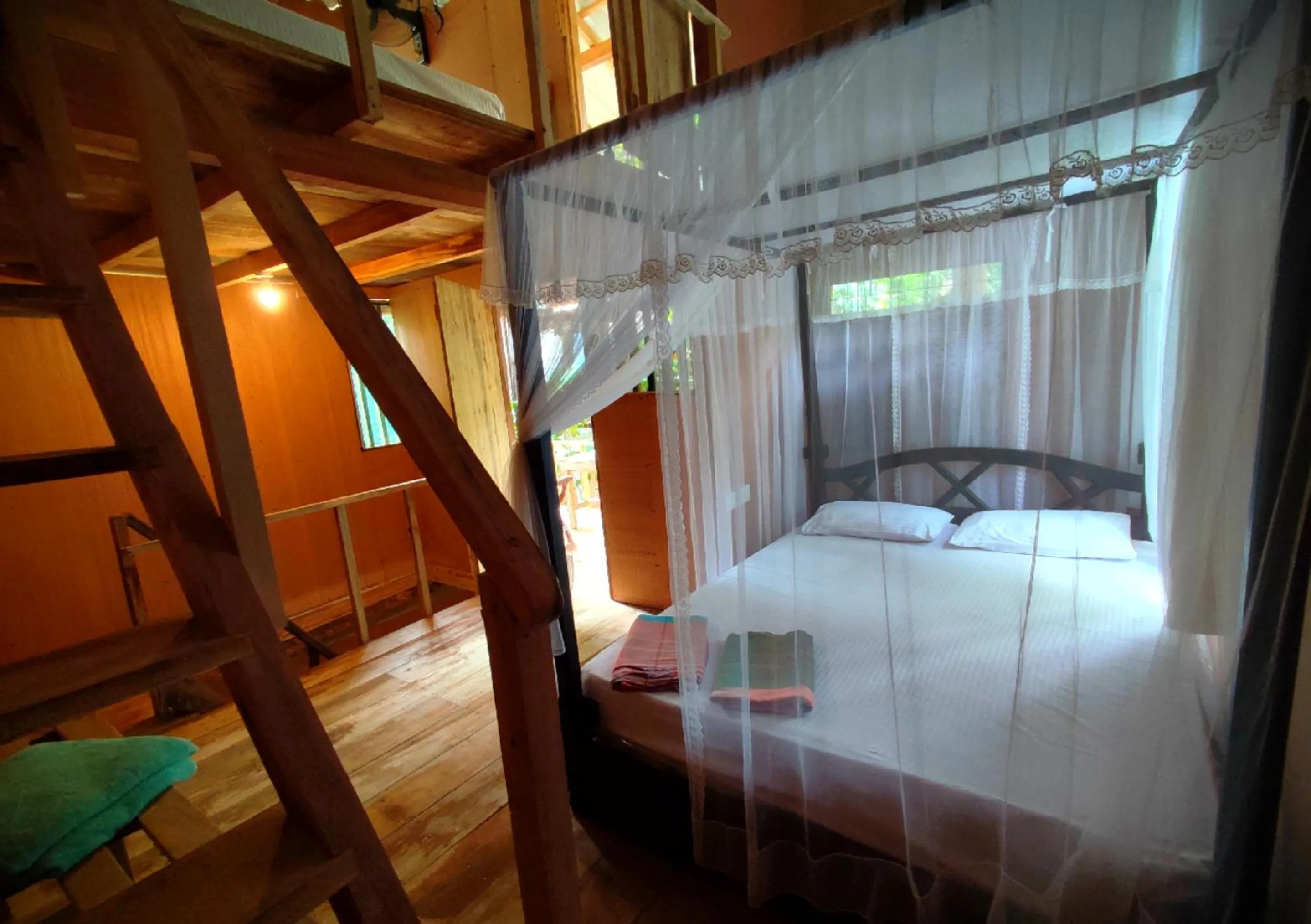 Bed in Sigiriya River Side Villa