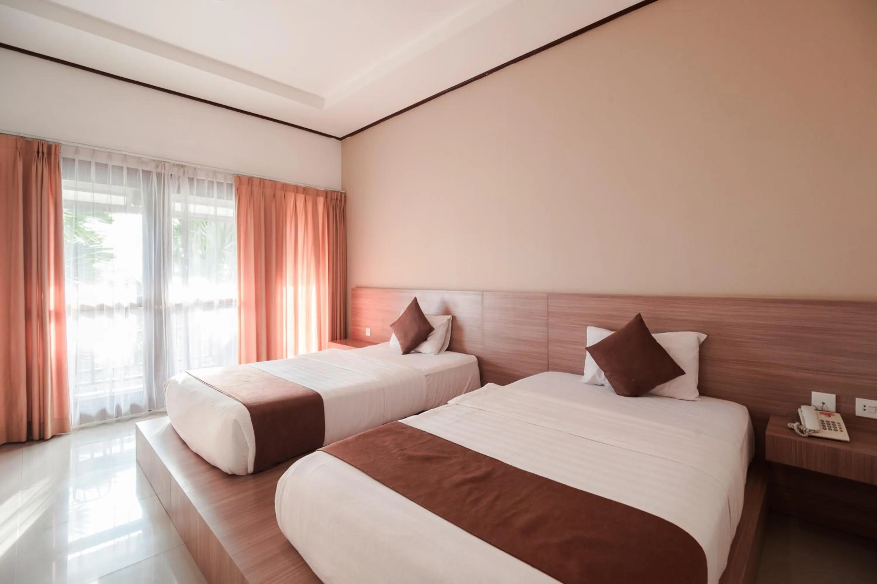 Bed in Surya Kencana Seaside Hotel