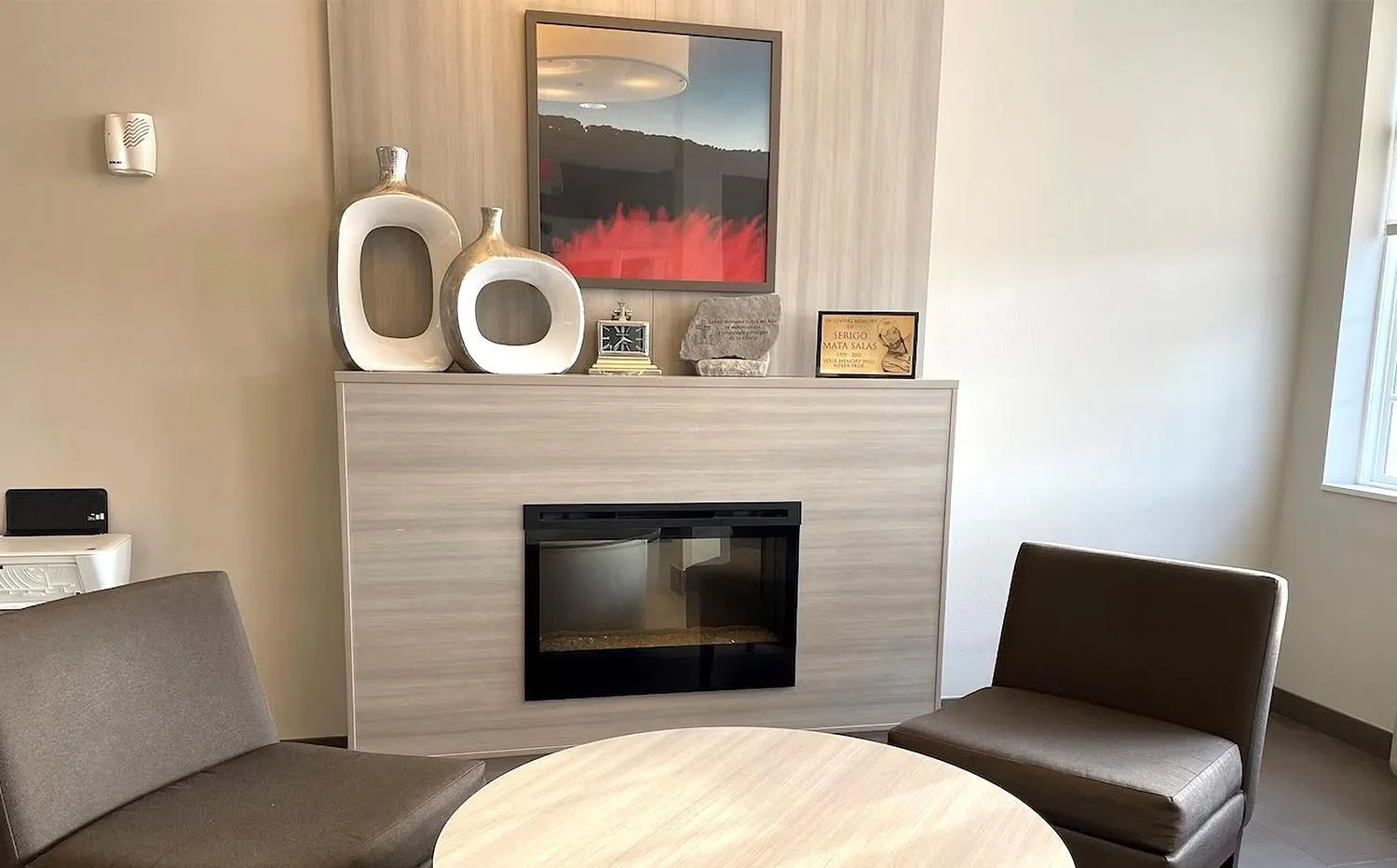 fireplace in Coratel Inn & Suites By Jasper Rochester
