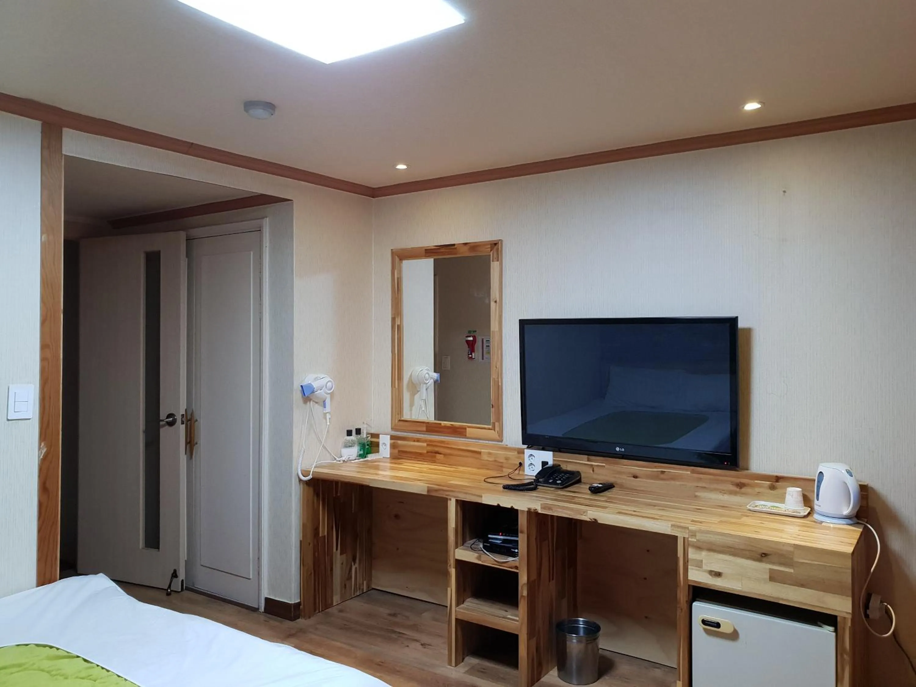 Bed in Green and Blue Hotel