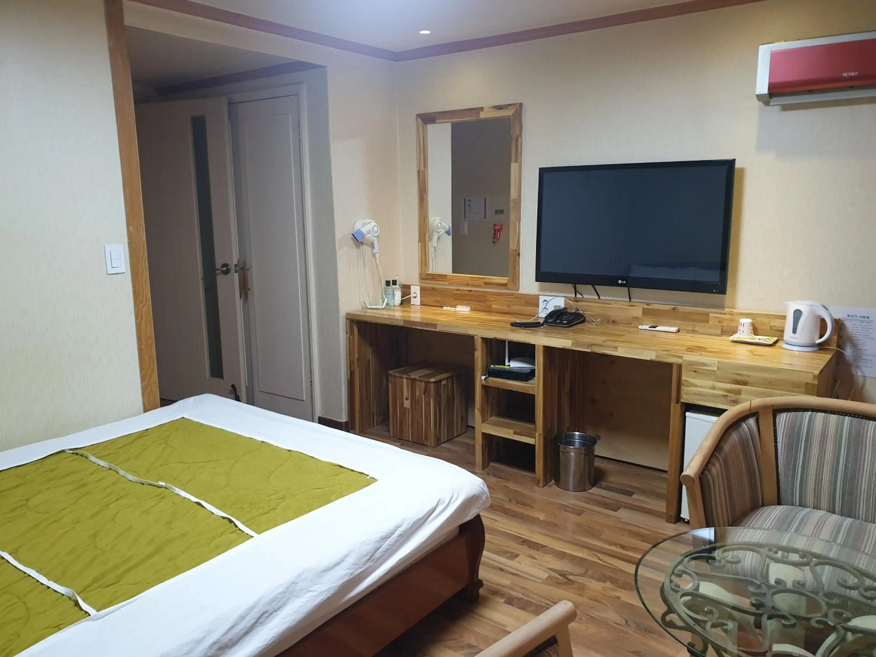 Bed in Green and Blue Hotel