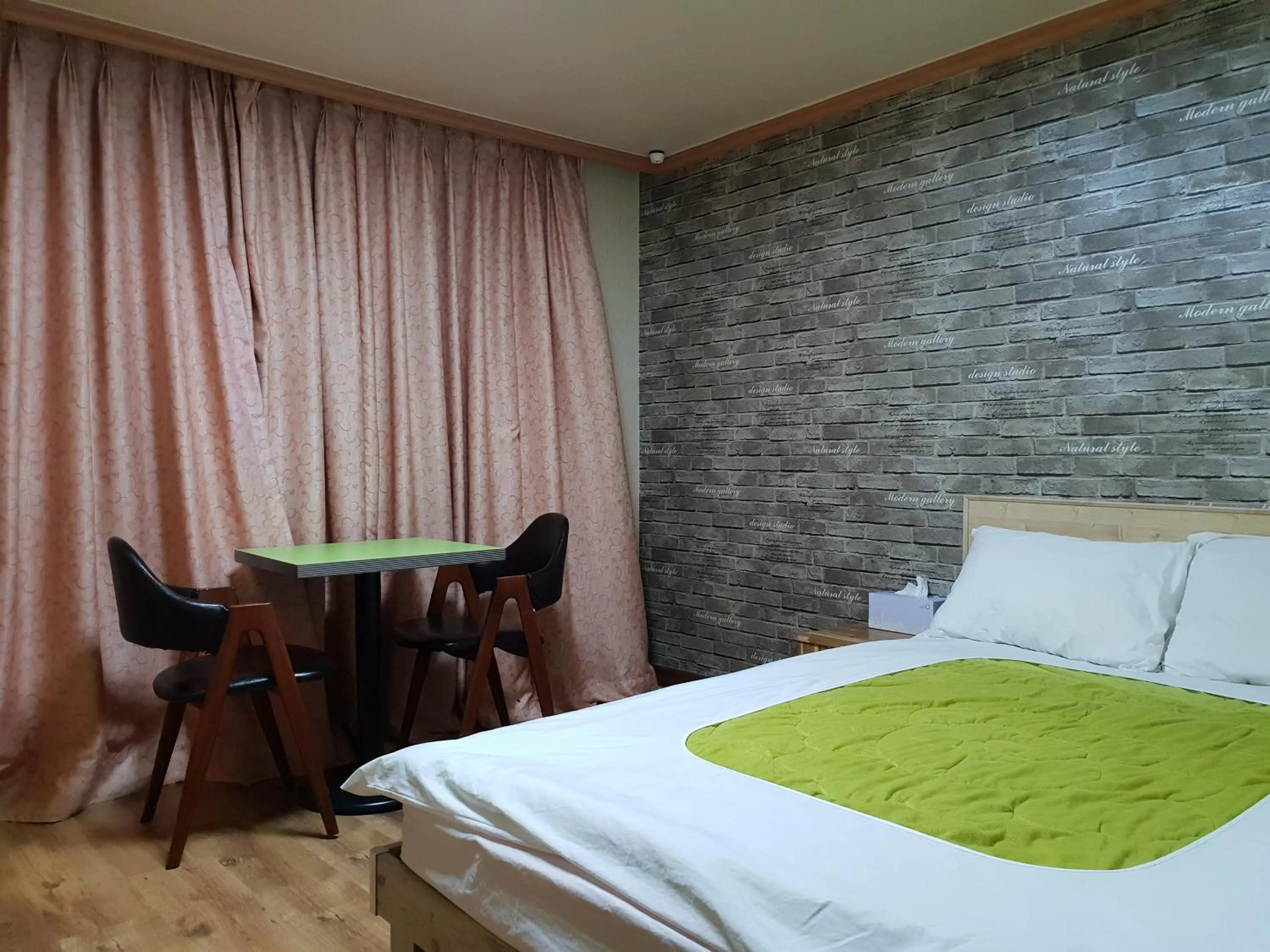 Bed in Green and Blue Hotel