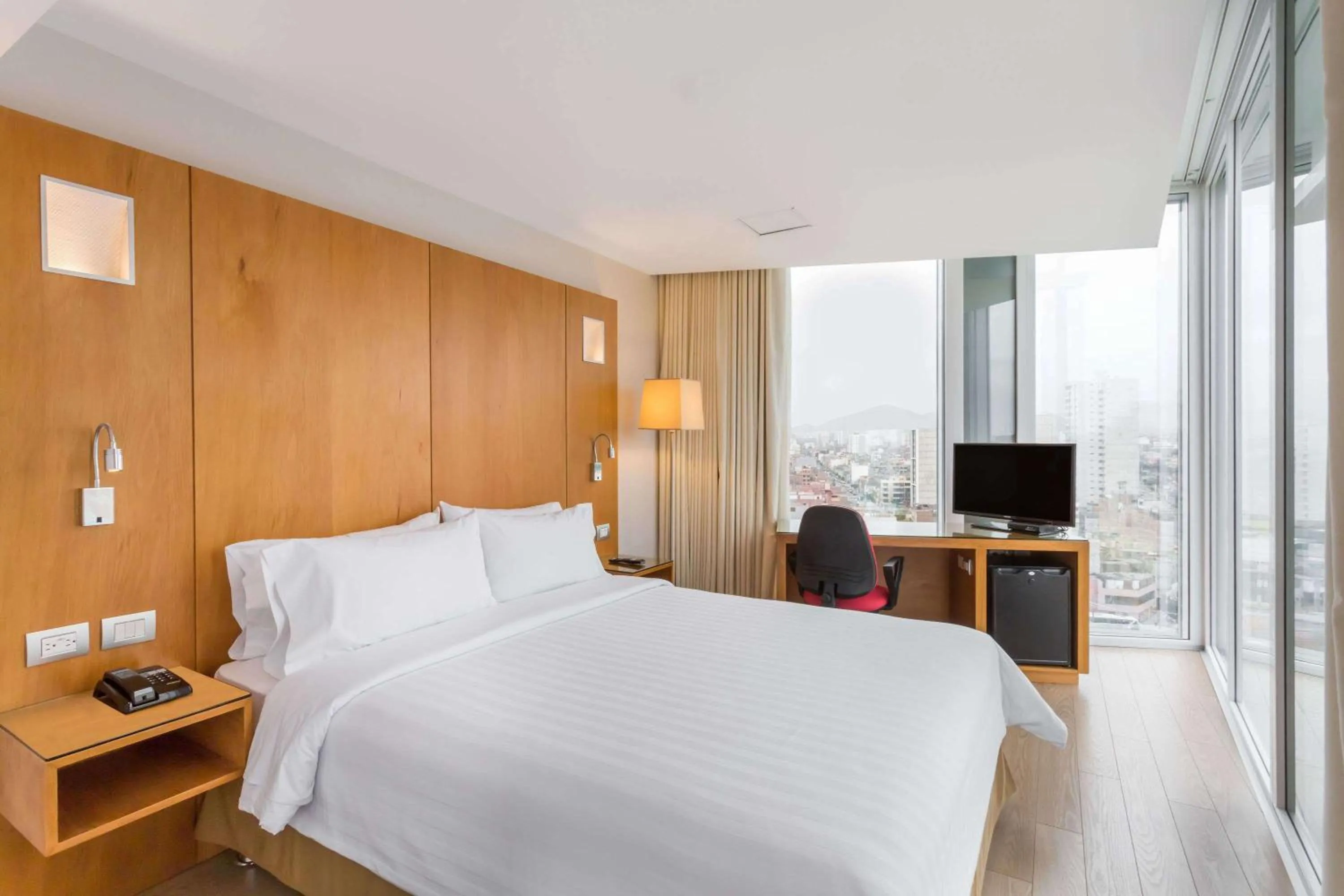 Photo of the whole room, Bed in Ramada Encore by Wyndham Lima San Isidro