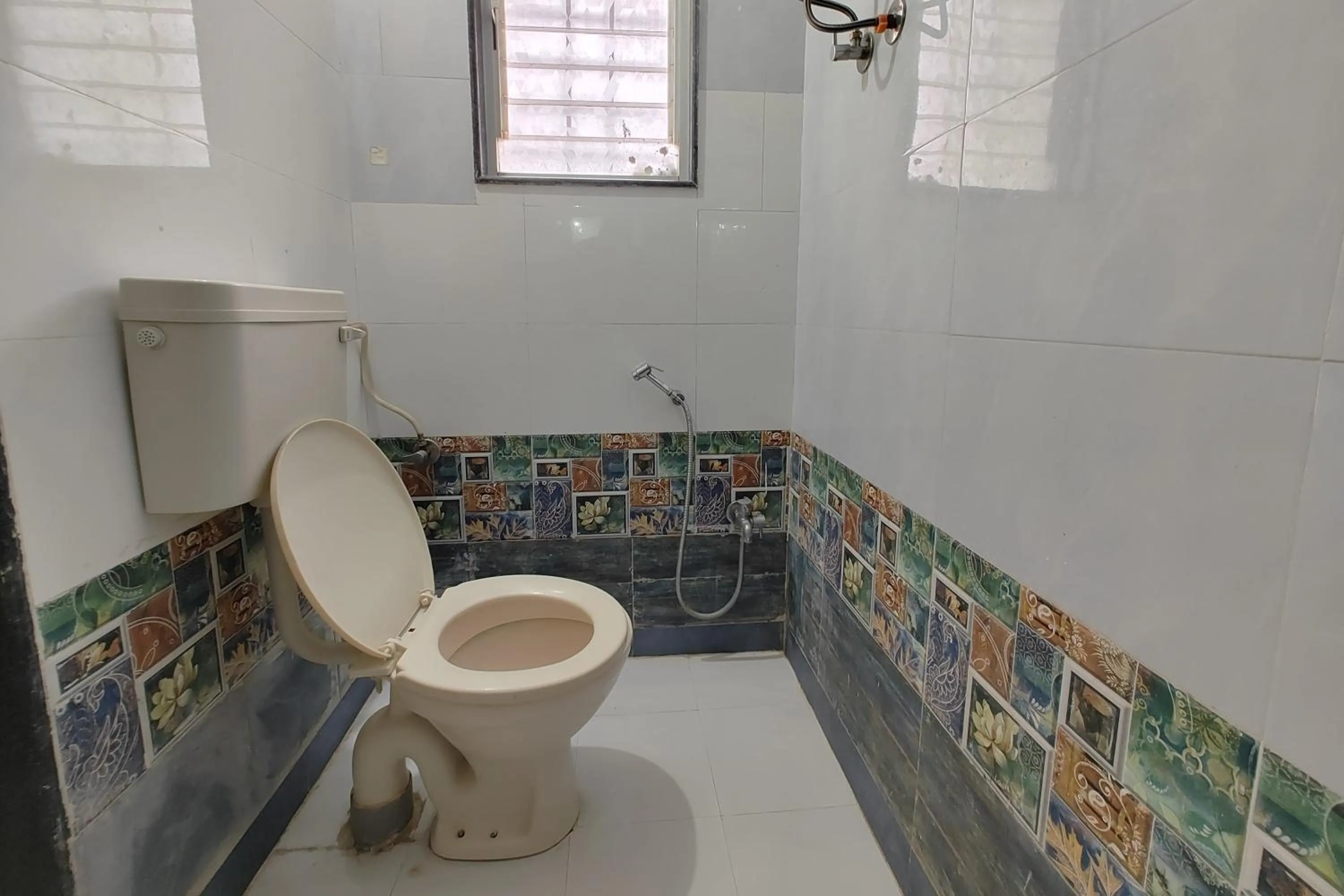 Bathroom in Sai Vishwa Lodging