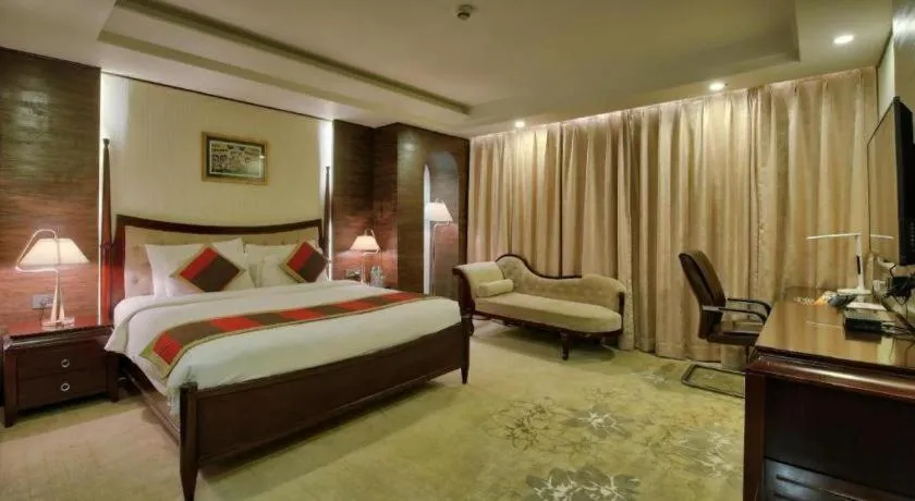 Bed in POLO Inn & Suites