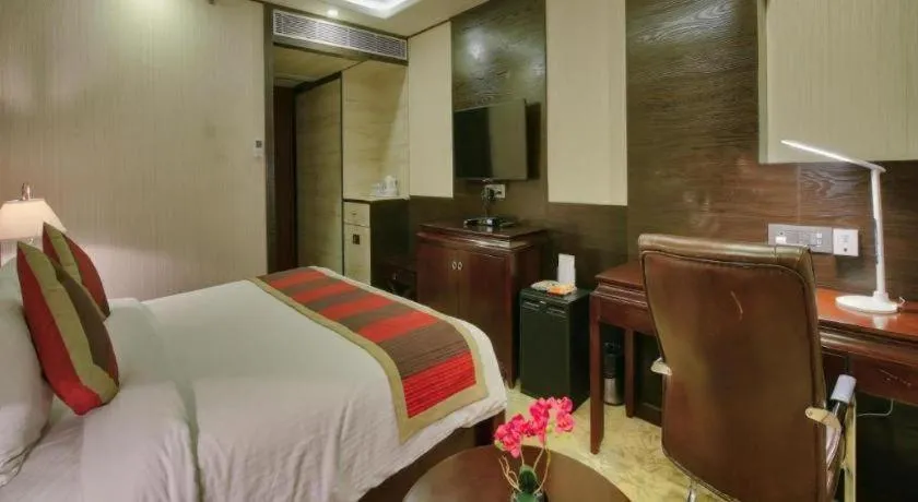 Bed in POLO Inn & Suites