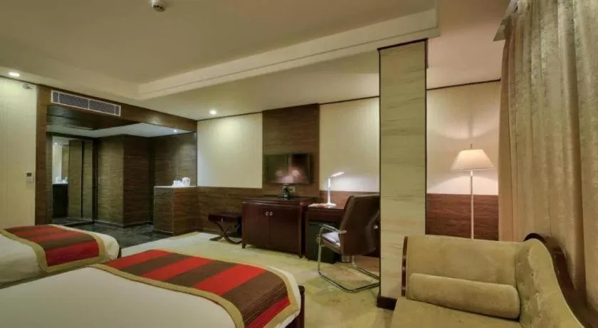 Bed in POLO Inn & Suites