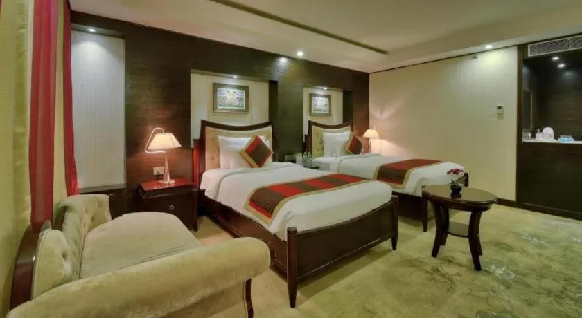 Bed in POLO Inn & Suites