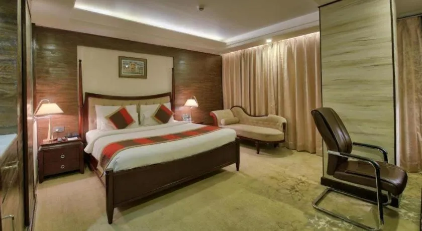 Bed in POLO Inn & Suites