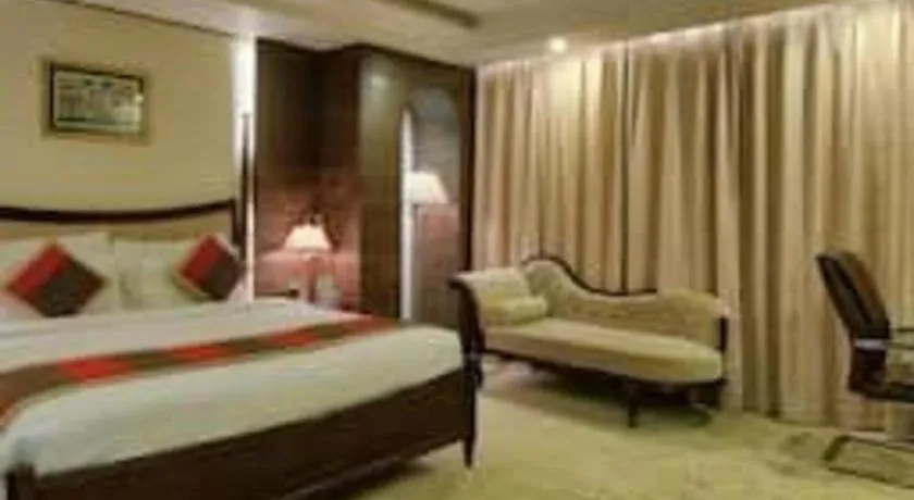 Bed in POLO Inn & Suites