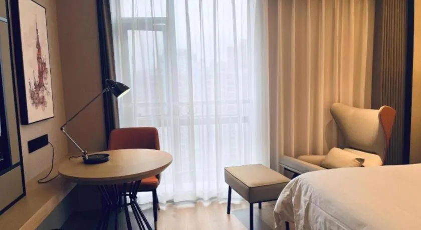 Bed in Vienna International Hotel Wuhan Huanghelou Pengliuyang Metro Station