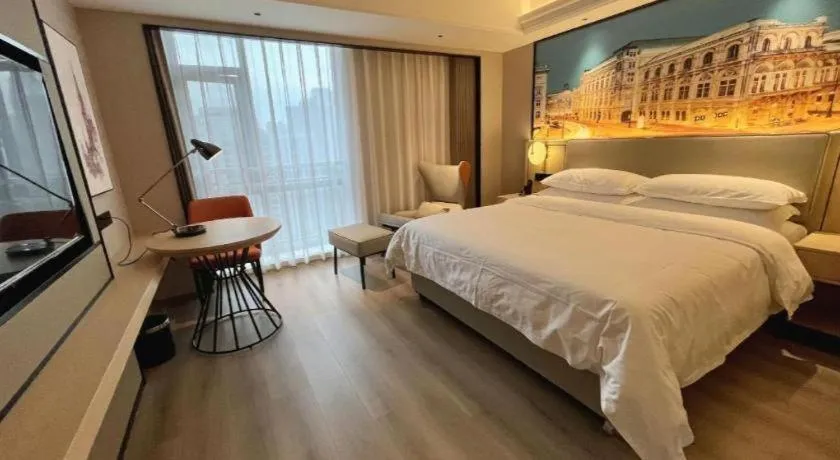 Bed in Vienna International Hotel Wuhan Huanghelou Pengliuyang Metro Station
