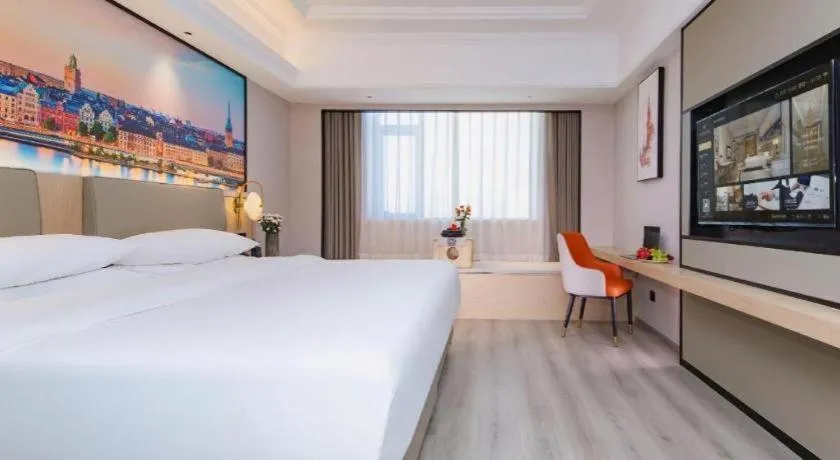 Bed in Vienna International Hotel Wuhan Huanghelou Pengliuyang Metro Station