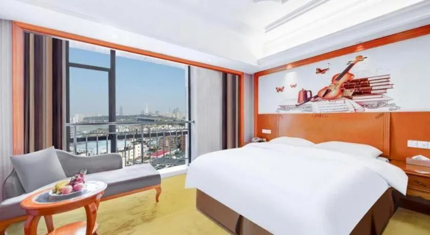 Bed in Vienna International Hotel Wuhan Huanghelou Pengliuyang Metro Station